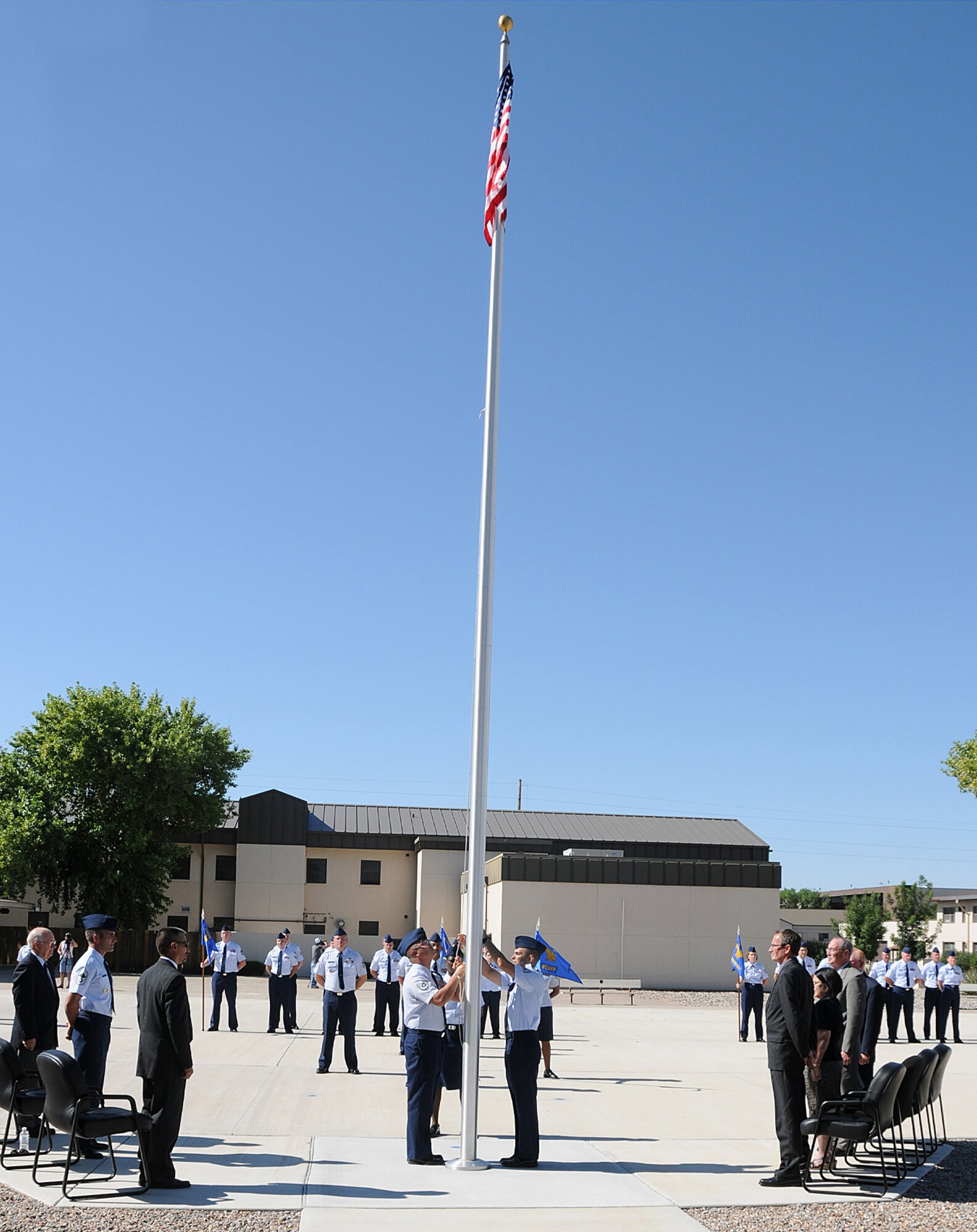 A final pass in review and lowering of the colors for the last time took place at the Kirtland AFB Noncommissioned Officer Academy, July 31, prior to the Inactivation Ceremony later that evening. The event brought to a close 54 years of educating NCOs in the art of leadership. U.S. Air Force photo by Dennis Carlson