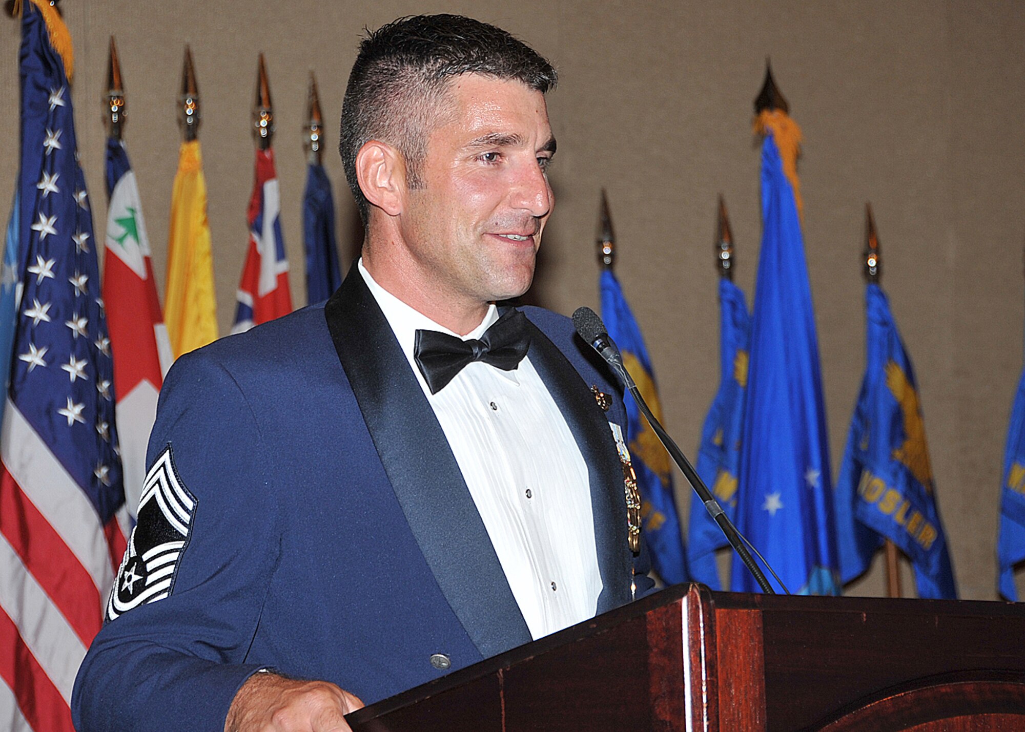 Retired eighth Chief Master Sergeant of the Air Force Sam Parish receives the last salute of the Kirtland AFB Noncommissioned Officer Academy during a pass in review, July 31. U.S. Air Force photo by Dennis Calrson