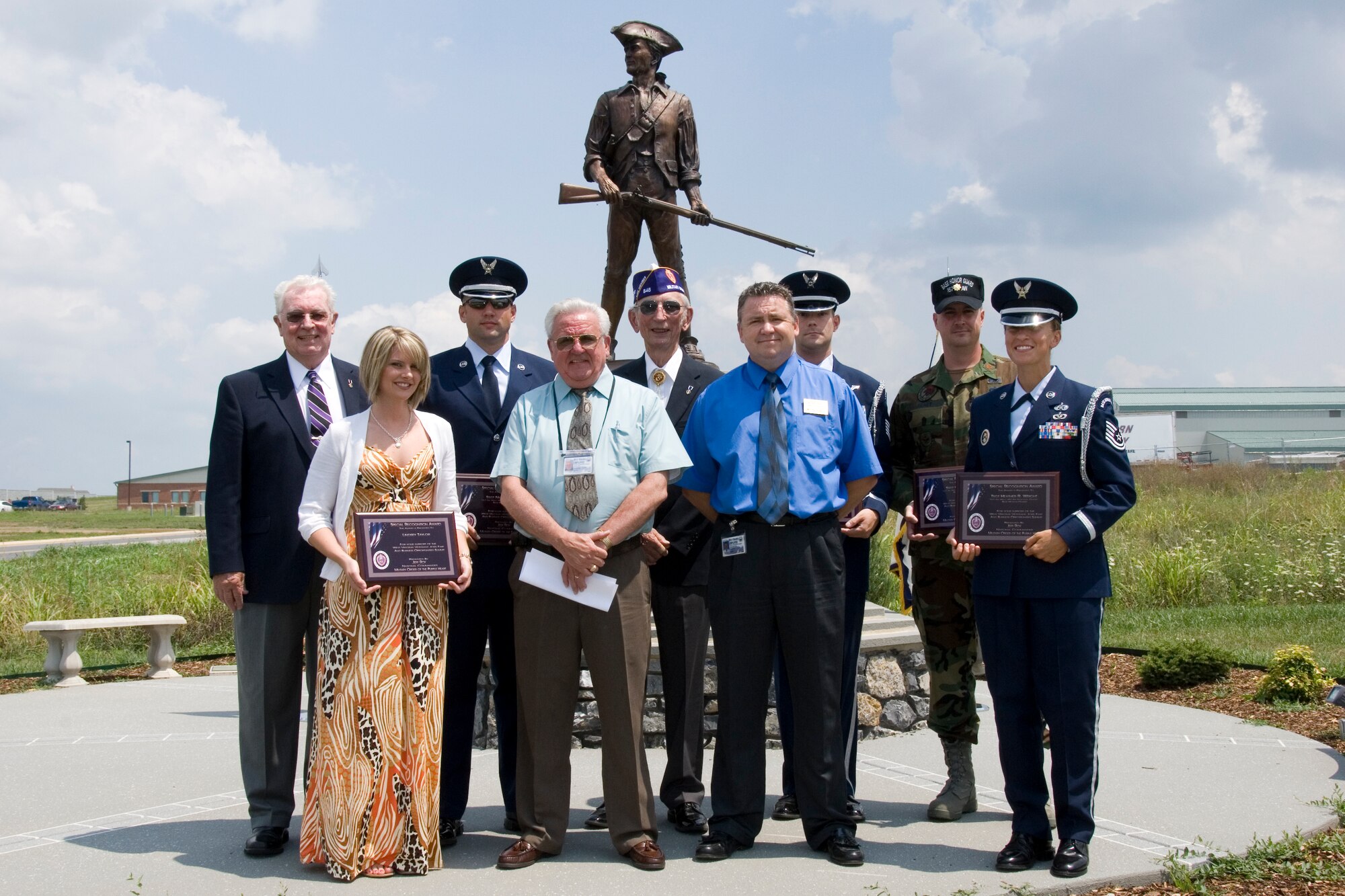 West Virginia Military Order of the Purple Heart presented members of the 167th Airlift Wing Base Honor Guard and Lindsey Taylor plaques of appreciation for their participation in a job fair and business opportunities summit held at the Martinsburg Veterans Administration Medical Center in June. The plaques were presented during a ceremony at the 167th Airlift Wing on August 1, 2009. In the front row, Lindsey Taylor, Otis Batten, Work Force West Virginia, Local Veterans Employment Rep, Monty Hogbin, Work Force West Virginia, Disabled Veterans Outreach Program Specialist, Tech Sergeant Heather Wright. Back row, Cy Kammeier, Commander Chapter 646, Military Order of the Purple Heart, Staff Sergeant Nic Krukowski, Richard Seeley, Department Commander WV, Military Order of the Purple Heart, Tech Sergeant William Stuller, and Major Paul Henry, 167th Airlift Wing Base Honor Guard, Officer in Charge. (U.S. Air Force photo by Master Sgt Emily Beightol-Deyerle)