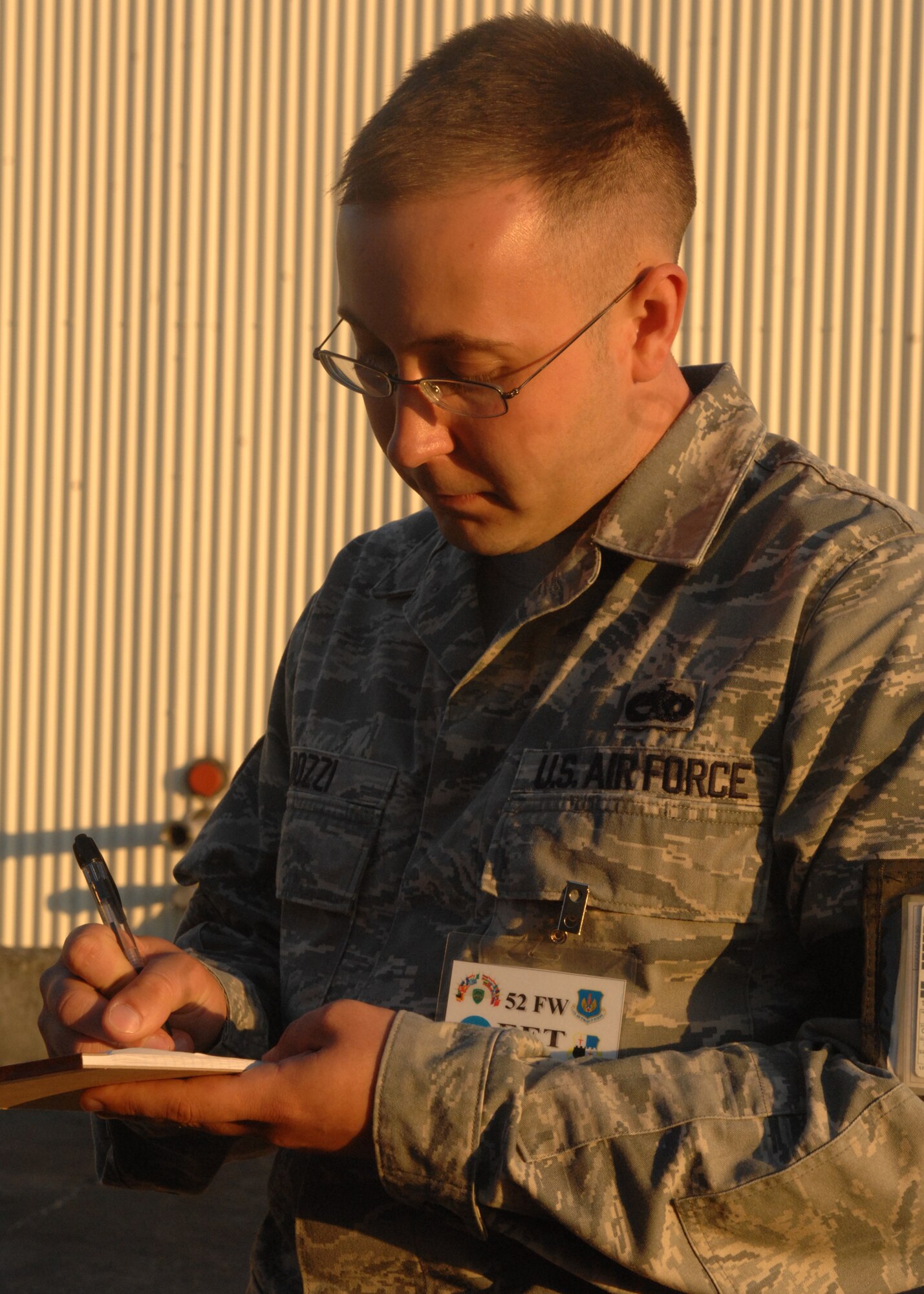 SPANGDAHLEM AIR BASE, Germany -- Staff Sgt. Tony Bozzi, 52nd Fighter Wing quality assurance inspector and exercise evaluation team member, takes notes after inspecting 52nd Logistics Readiness Squadron fuels Airmen Aug. 4 during the 52nd Fighter Wing’s Phase II exercise. Spangdahlem Airmen used the exercise to prepare for the NATO Tactical Evaluation in June 2010. (U.S. Air Force photo/Senior Airman Jenifer H. Calhoun)