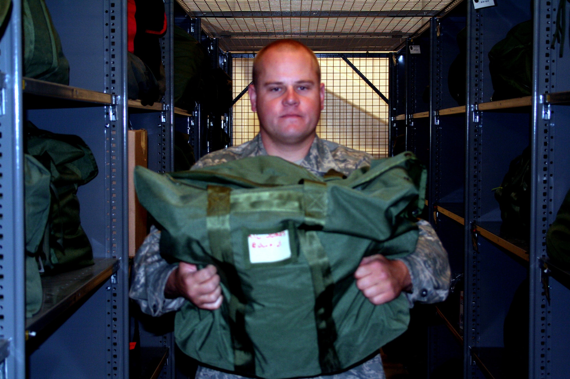 Staff Sgt. Johnny Hudson, from the 573rd Global Support Squadron at Travis Air Force Base, Calif., prepares some deployment kits at the unit's deployment warehouse Aug. 6, 2009.  The 573rd GSS is part of the 615th Contingency Response Wing at Travis Air Force Base, Calif.  CRWs are Air Mobility Command's quick reaction force for humanitarian relief missions and for opening air bases any where in the world.  (U.S. Air Force Photo/Tech. Sgt. Scott T. Sturkol)