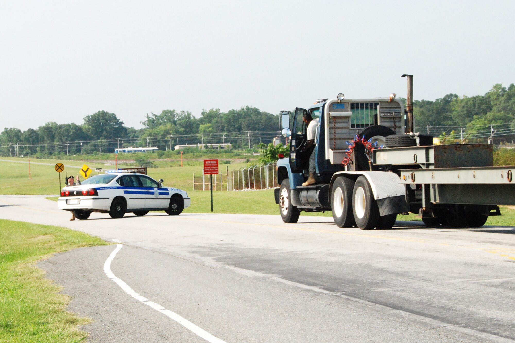 Tech. Sgt. Russell Jones, 94th Security Forces Squardon, uses his patrol car to cut off a suspect who entered the base without prior authorization during a simulated exercise Aug. 6. The exercise focused on the proper procedure regarding unauthorized vehicles trying to enter teh base.