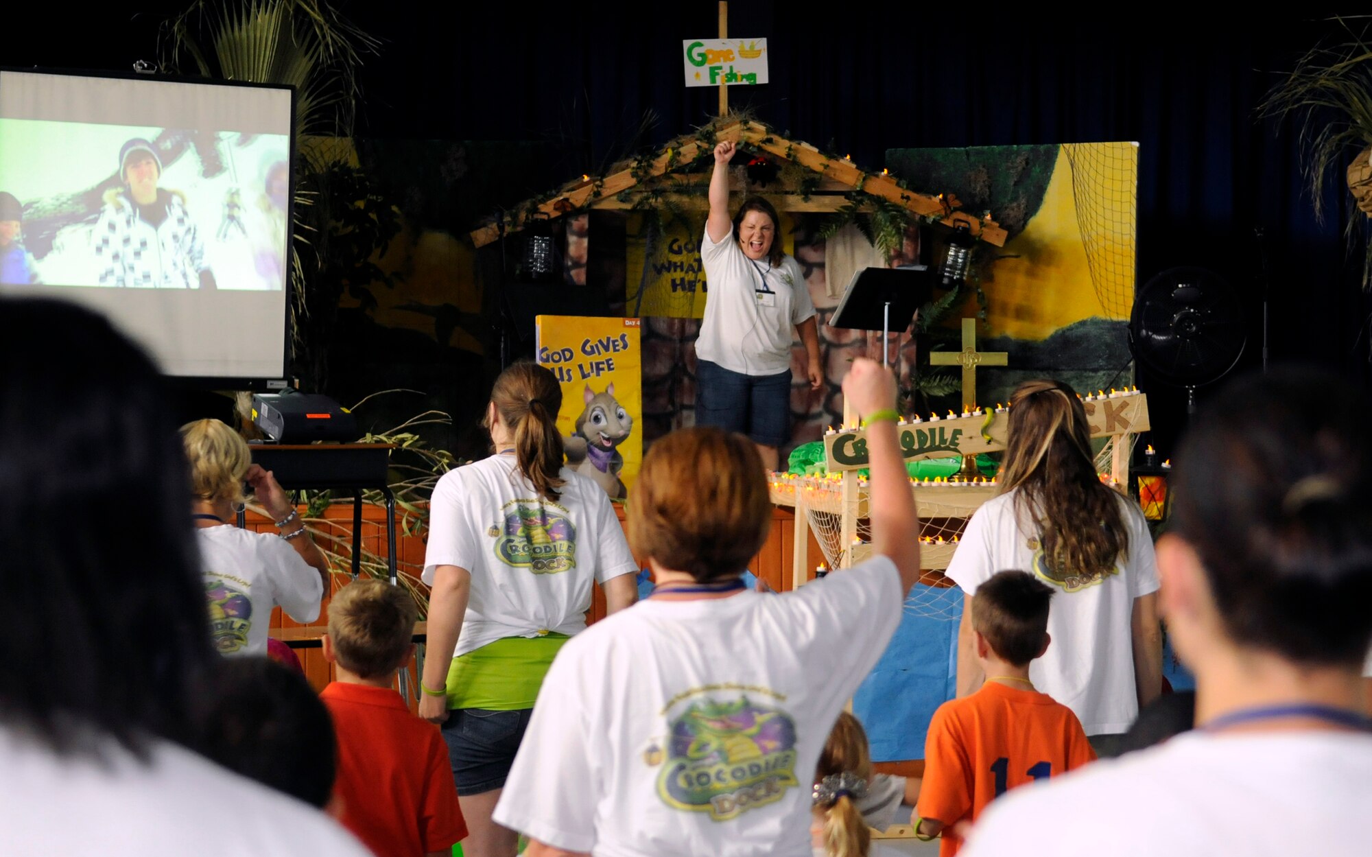 Incirlik children, along with their volunteer group leaders, sing along with one of the many songs played Friday, Aug. 7, 2009, during Vacation Bible School at the Incirlik Unit School, Incirlik Air Base, Turkey.   Vacation Bible School is a summer program sponsored by base chapels across the Air Force.  Participants learn about and reenact various scenes from the bible throughout the week.  (U.S. Air Force photo/Staff Sgt. Raymond Hoy)