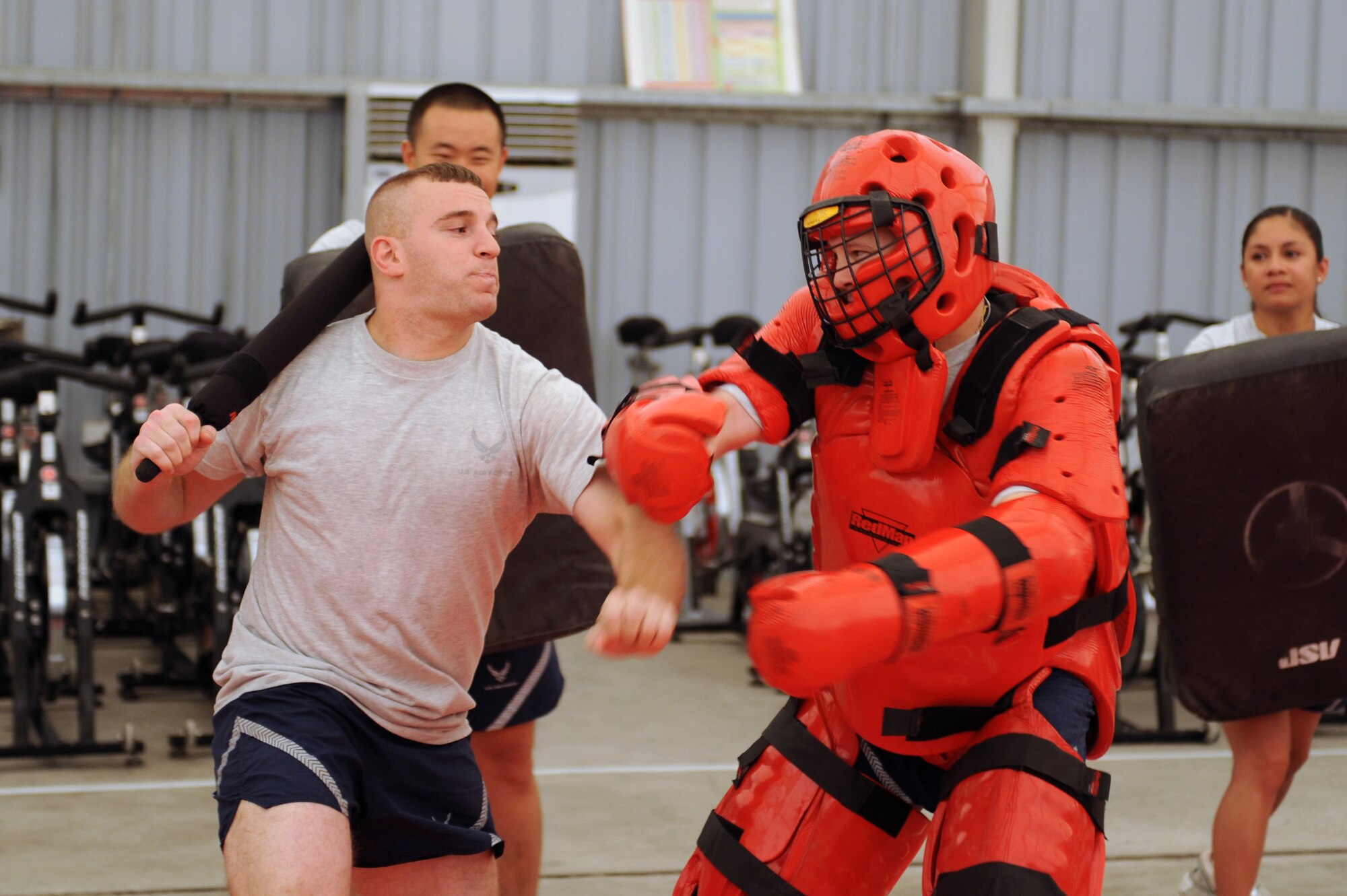 SOUTHWEST ASIA - Senior Airman Brian McLeod, 380th Expeditionary Security Forces Squadron, prepares to strike Tech. Sgt. Anthony Burleson, 380th ESFS, during the 380th ESFS baton combat training Aug 7. Airman McLeod is deployed from Dover Air Force base, Del., and hails from Ashtabula, Ohio. Sergeant Burleson is deployed from Tinker AFB, Okla., and hails from Sweetwater, Texas.  (U.S. Air Force photo/Tech. Sgt. Charles Larkin Sr) 