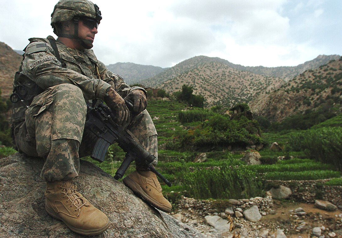 U.S. Army Staff Sgt. Jeremy Torres-Cortes scans the Wadawu valley during Operation Silver Creek in Nuristan province, Afghanistan, Aug. 7, 2009.