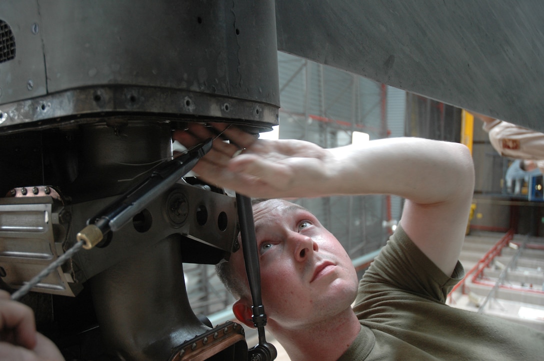 Lance Cpl. Kenneth Aoford, Marine Attack Squadron 513 airframer, safety wires bolts on an AV-8B Harrier in the squadron's hangar at the Marine Corps Air Station in Yuma, Ariz., Aug. 10, 2009. Aoford is one of approximately 150 Marines scheduled to deploy Aug. 16 and 21, 2009, in support of the 31st Marine Expeditionary Unit based in Japan. "This is going to be my first deployment," said Aoford. "I'm pretty excited, this is going to be a very new experience." While in Japan the squadron is slated to participate in exercises Ryuku Warrior, Talisman Saber and Wolmi-Do Fury.