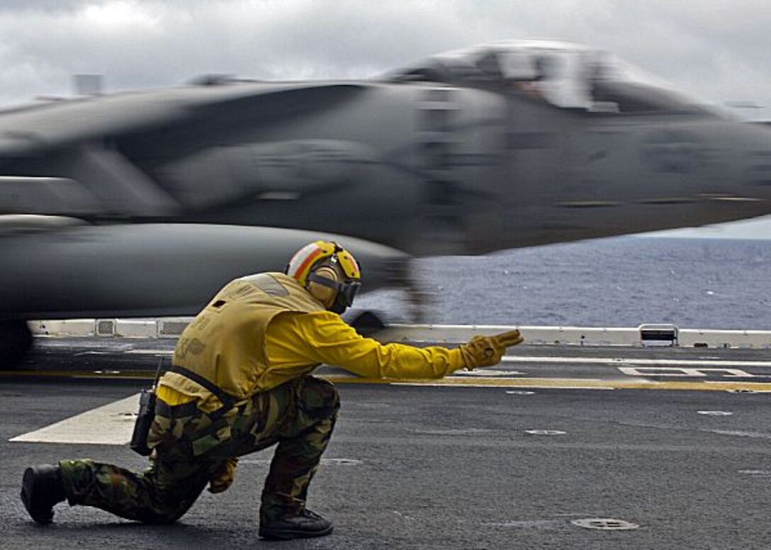 A Marine Attack Squadron 211 AV-8B Harrier takes off from the flight deck of the USS Essex in the Philippine Sea Aug. 10, 2009. The Wake Island Avengers of VMA-211 are scheduled to return to the Marine Corps Air Station in Yuma, Ariz., Aug. 24 and 25 after a seven-month deployment with the 31st Marine Expeditionary Unit. Marine Attack Squadron 513 is slated to replace VMA-211 when the ship departs from Japan later this year.