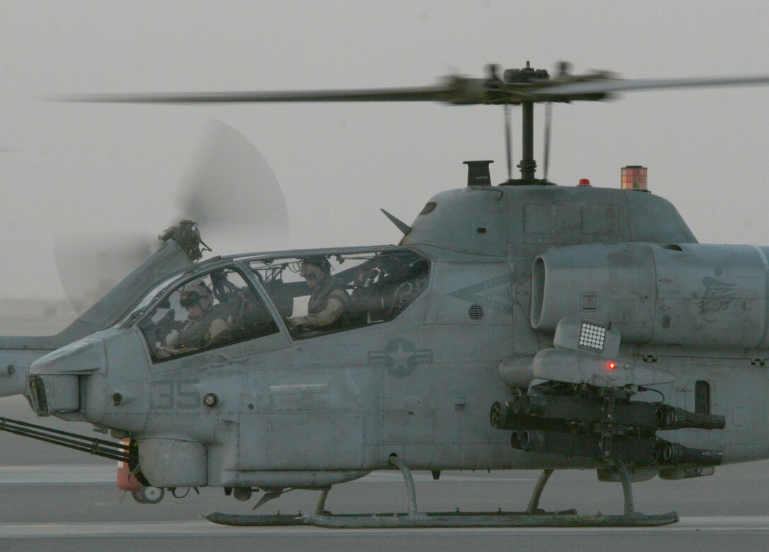 Pilots of an AH-1W Super Cobra from Marine Medium Tiltrotor Squadron 263 (Reinforced), 22nd Marine Expeditionary Unit, shut down their aircraft at Udairi Army Airfield, Kuwait, Aug. 10, 2009. Marines from VMM-263 (rein), the Aviation Combat Element for the 22nd MEU, joined other elements of the MEU ashore for sustainment training aboard Camp Buehring, Kuwait. The 22nd MEU is serving as the theater reserve force for U.S. Central Command.