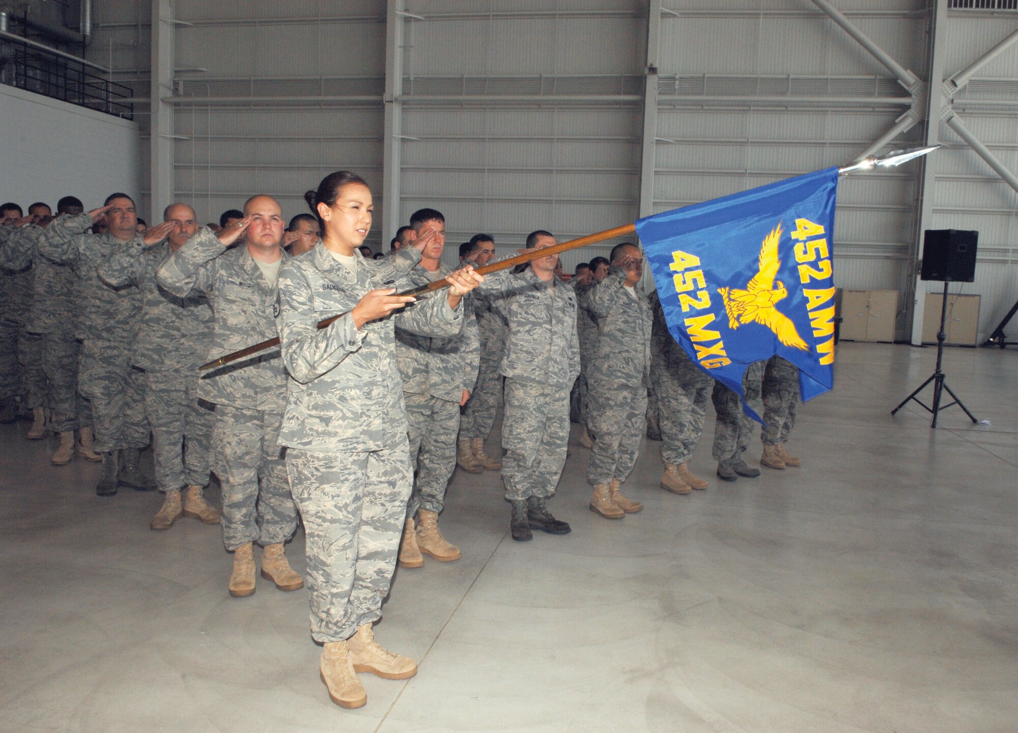 452nd Maintenance Squadron Airmen give the first salute to Lieutenant Colonel Mark S. Baker  (U.S. Air Force photos by Staff Sgt. Angel Gallardo)