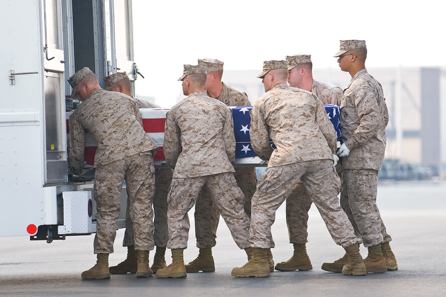 A U.S. Marine Corps carry team transfers the remains of Marine Lance Cpl. Patrick W. Schimmel, of Winfield, Mo., at Dover Air Force Base, Del., August 10.  Lance Cpl. Schimmel was assigned to 2nd Battalion, 8th Marine Regiment, 2nd Marine Division, II Marine Expeditionary Force, Camp Lejeune, N.C. (U.S. Air Force photo/Roland Balik)