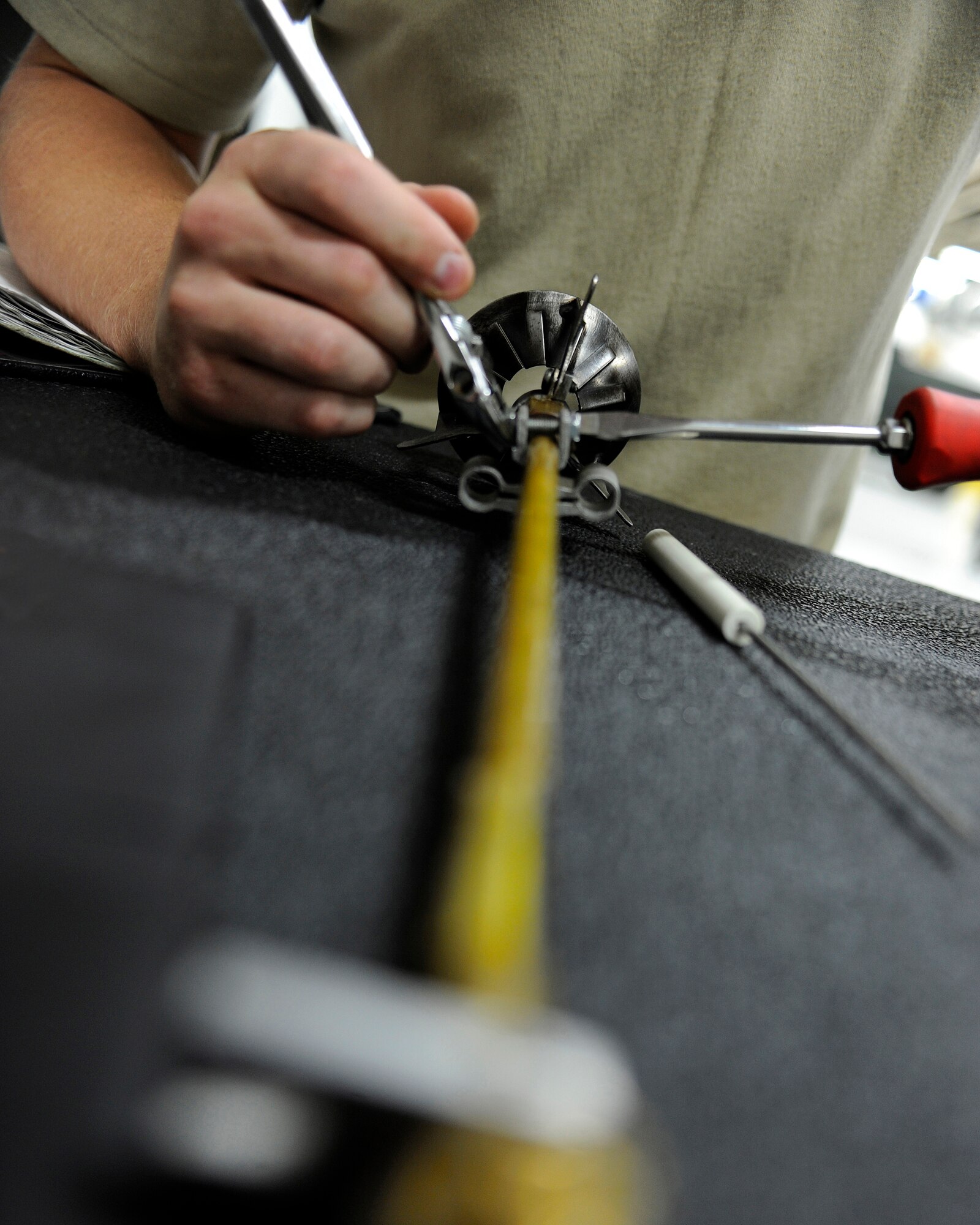 Airman 1st Class Jordan Boothe tightens an ignition assembly for an NGH heater July 31, 2009, Eielson Air Force Base, Alaska. The old ignition assembly needed to be replaced after it was discovered faulty during a routine inspection. Airman Boothe is an Aerospace Ground Equipment specialist in the 354th Maintenance Squadron. (U.S. Air Force photo/Airman 1st Class Willard E. Grande II)