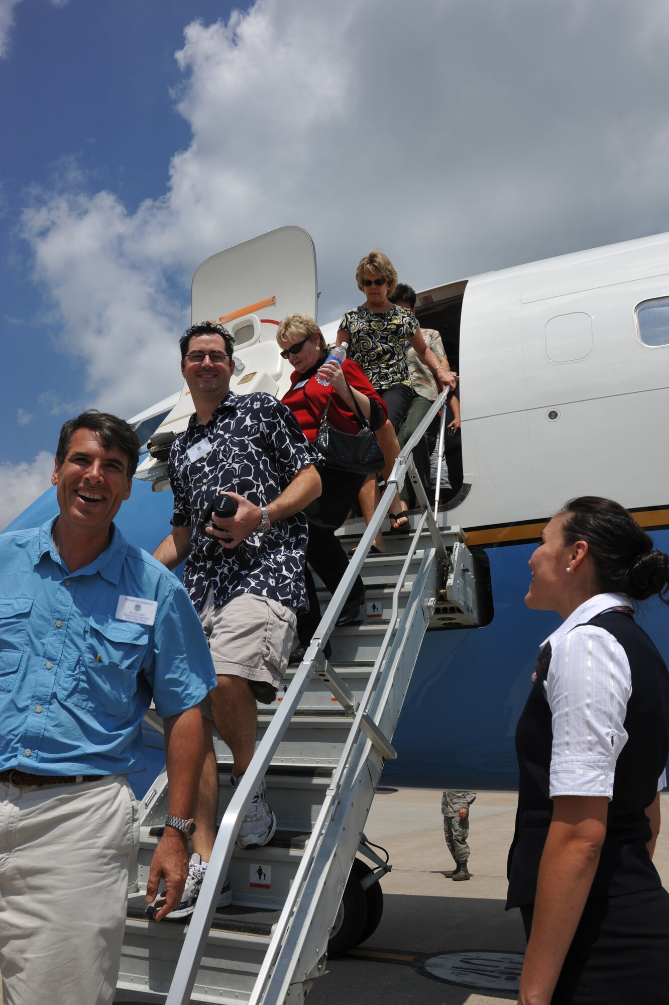 Civilian employers were all smiles after a Boss Day flight aboard a C-40C plane and various 932nd Airlift Wing tours that told the story of the Air Force Reserve.  A speaker from the Employer Support of the Guard and Reserve briefed as did the commander of the wing, Col. John "Jay" Flournoy, Jr.  (U.S. Air Force photo/Maj. Stan Paregien)