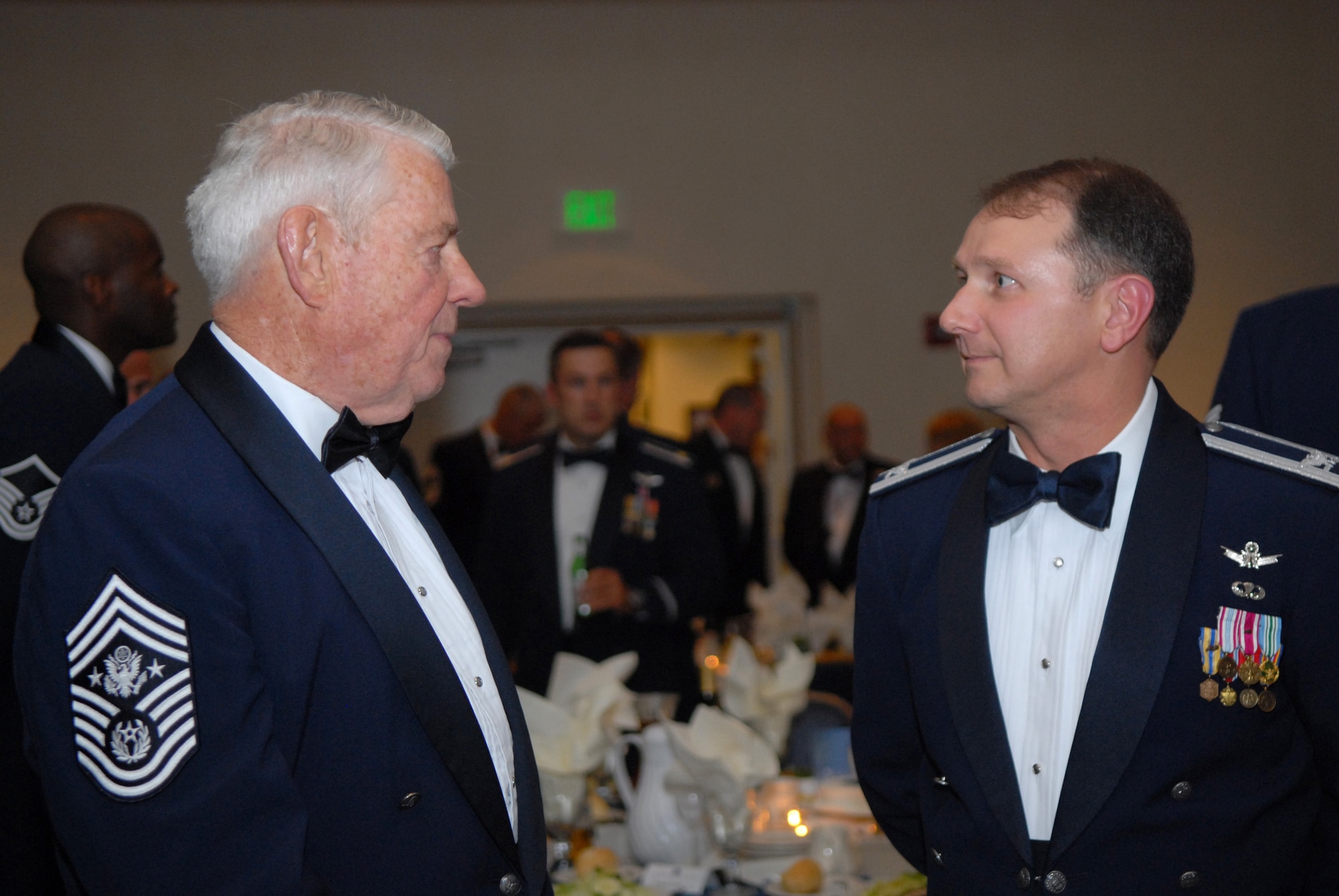 VANDENBERG AIR FORCE BASE, Calif. – Former Chief Master Sgt. of the Air Force Robert Gaylor chats with Col. Steven Winters, the 30th Space Wing vice commander, at a senior NCO induction ceremony held at the Pacific Coast Club here Aug. 7. Approximately 45 senior NCOs were inducted at the ceremony. (U.S. Air Force photo/Airman 1st Class Kerelin Molina) 
