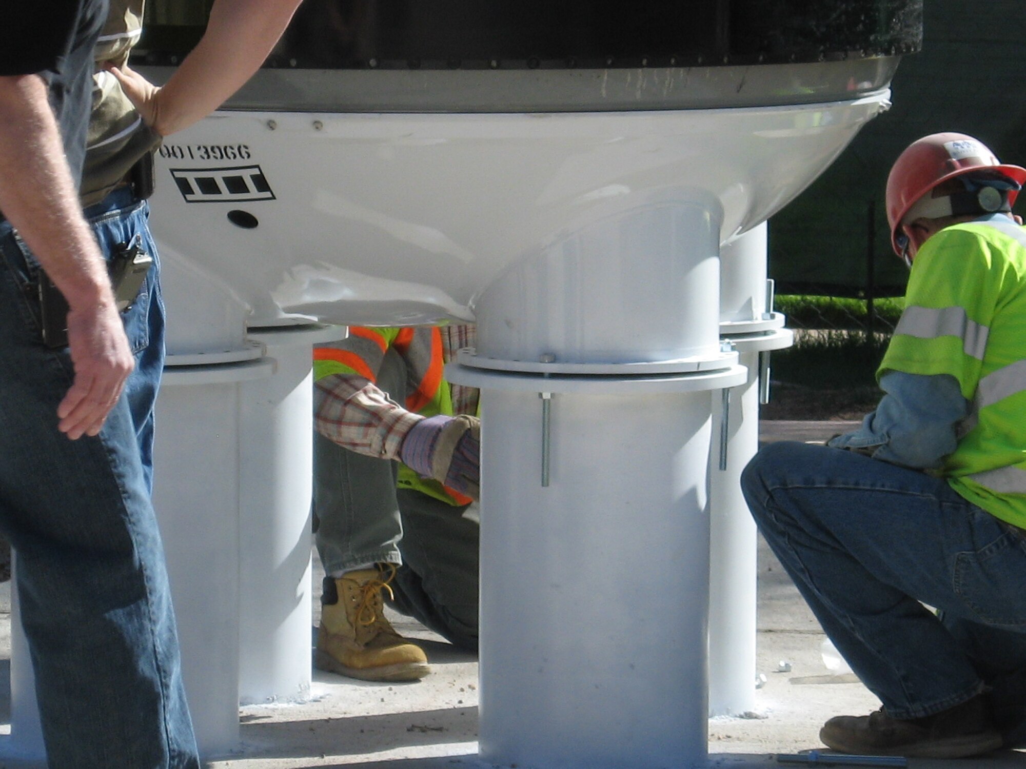Mounting the Minuteman III display involves four tubes extending below ground to support the weight of the entire assembled missile, which is more than 59 feet high. The tubes are covered by a removable metal skirt to stabilize the assembly. (U.S. Air Force photo by Gail Whalen)