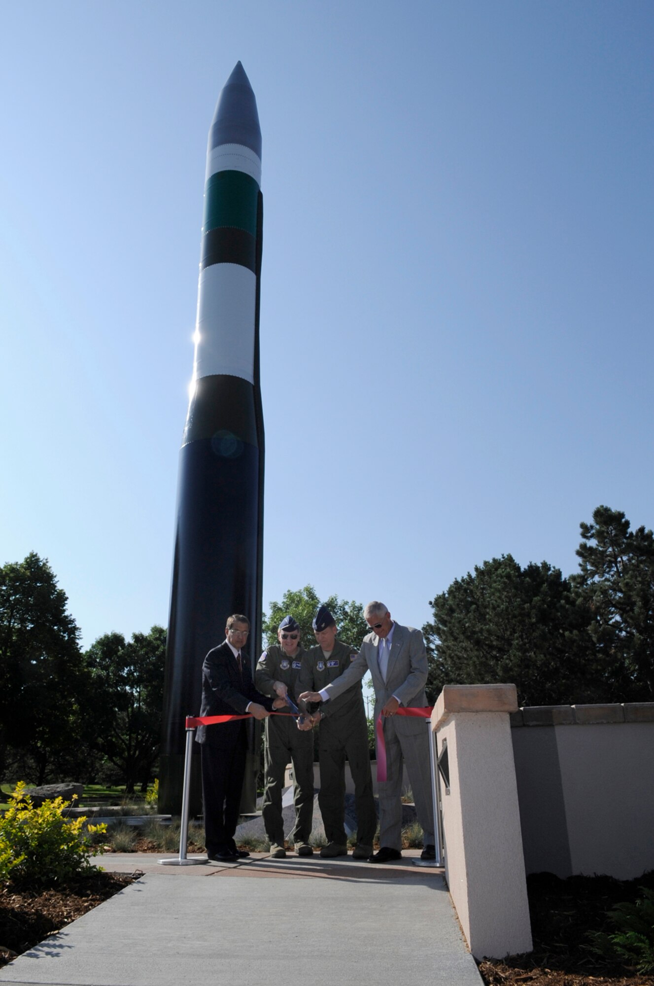 (Left to right) Retired Col. Lamberth Blalock, Gen. C. Robert Kehler, Air Force Space Command commander, Col. Wayne Monteith, 21st Space Wing vice commander, and retired Lt. Gen. Jay Kelley dedicate the Minuteman III ICBM display Aug. 11 at Peterson. The display offers information about the Minuteman’s heritage, and is designed to help preserve and portray the rich aviation and space history of Colorado Springs and Peterson Air Force Base. (U.S. Air Force photo by Rob Bussard)