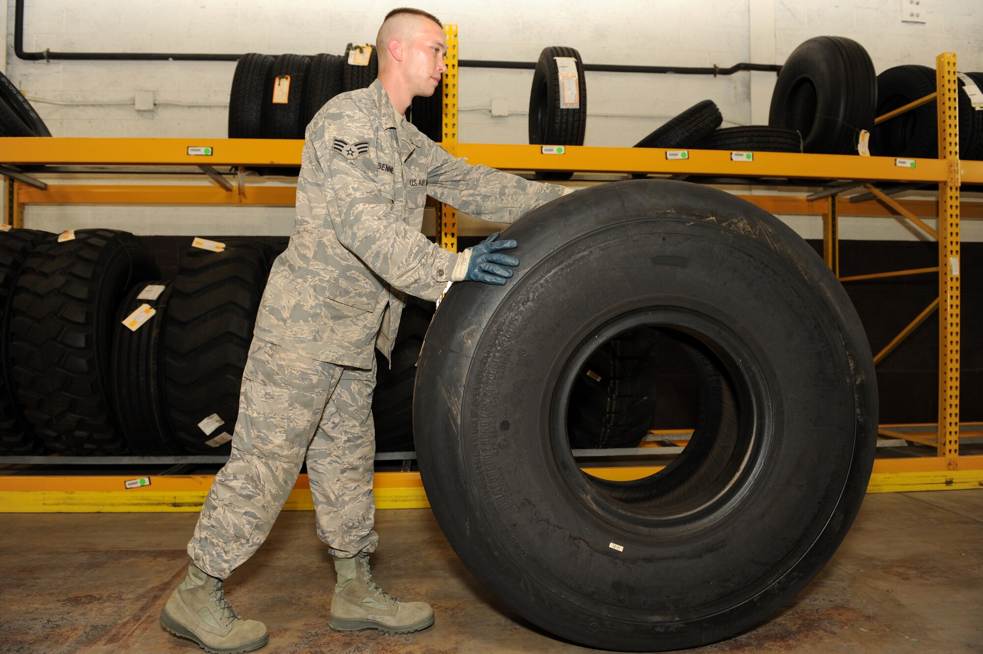 Senior Airman David Bennett, 19th Logistics Readiness Squadron, stores a C-130 main tire at Little Rock Air Force Base, Ark. May 8. (U. S. Air Force photo by Senior Airman Jim Araos)