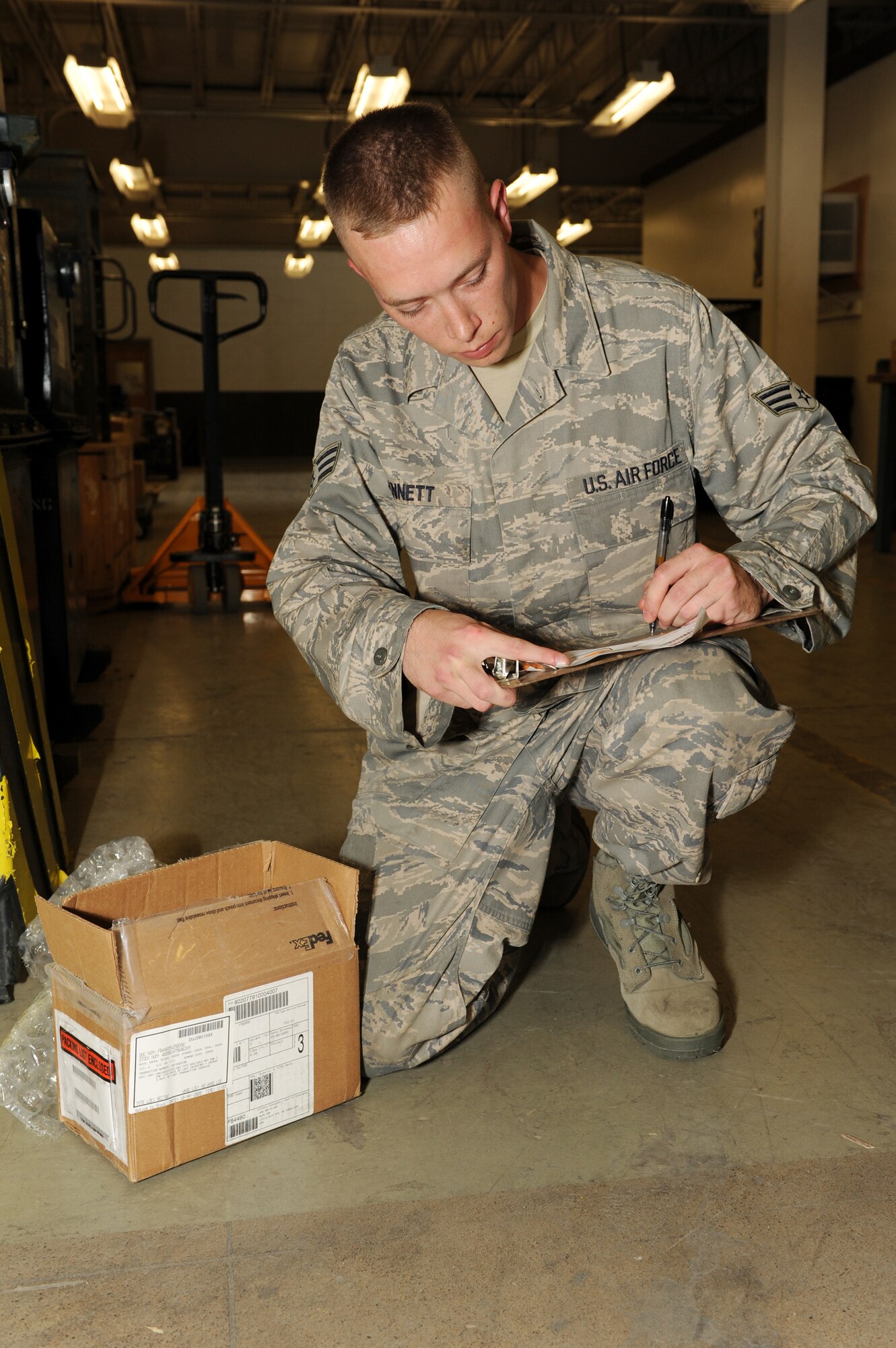 Senior Airman David Bennett, 19th Logistics Readiness Squadron, creates a serviceable tag for a part at Little Rock Air Force Base, Ark. May 8. (U. S. Air Force photo by Senior Airman Jim Araos)