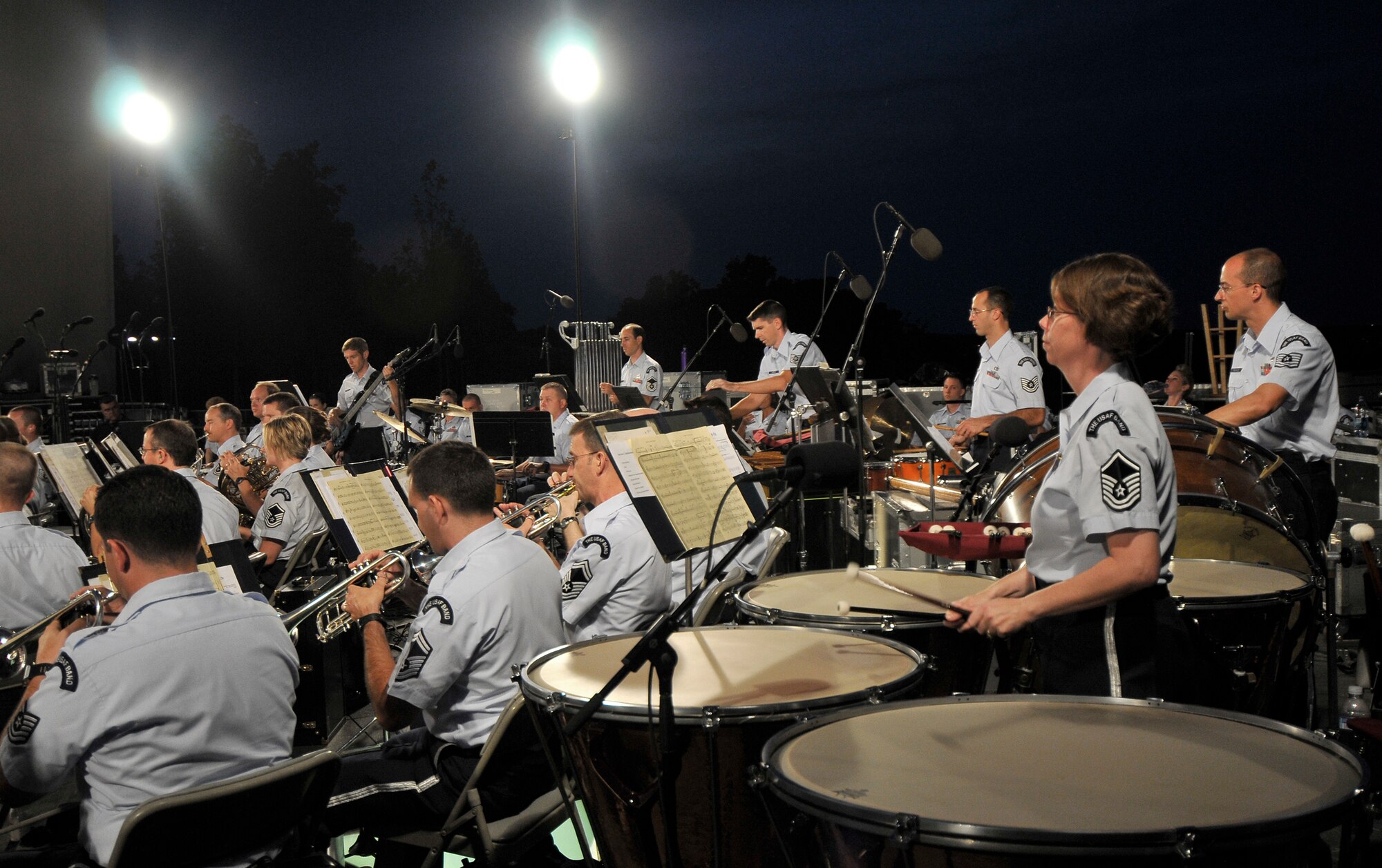 The United States Air Force Band performs at the Air Force Memorial Aug. 7 in Arlington, Va. as part of their Summer Concert Series. The Air Force Band performs at the Air Force Memorial Wednesdays and Fridays as part of their Summer Concert Series, with no fee for attendance. Musical pieces from “The Wizard of OZ” and “Annie” were performed. Every military branch’s song was played by the Band to honor all past and present military members. (U.S Air Force photo by Nedia Holliday)  