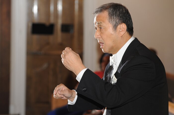 NELLIS AIR FORCE BASE, Nev. - Mr. Chai Hoon-Cha, conducts singers of the Chai Hoon-Cha choir during a performance for Nellis Airmen, family and friends at the base chapel here, Aug. 10. The Chai Hoon-Cha Choir, is an internationally recognized choir from Seoul, South Korea. The performance included seven songs, some were sang in English and others were sang in Korean. Founded in 2001, the group performed in the United States and Canada from Aug. 6 to 14.  This visit to Nellis marks a first for the famed choir.  (U.S. Air Force photo by Tech. Sgt. Michael R. Holzworth)
