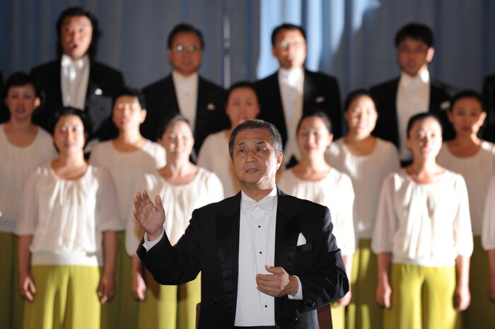 NELLIS AIR FORCE BASE, Nev. - Mr. Chai Hoon-Cha leads a sing along of "Let there be Peace on Earth" with Nellis Airmen, family and friends in a performance with the Chai Hoon-Cha Choir, an internationally recognized choir from Seoul, South Korea, at the Nellis Base Chapel, Aug. 10. The performance included seven songs, some were sang in English and others were sang in Korean. Founded in 2001, the group performed in the United States and Canada from Aug. 6 to 14.  This visit to Nellis marks a first for the famed choir.  (U.S. Air Force photo by Tech. Sgt. Michael R. Holzworth)