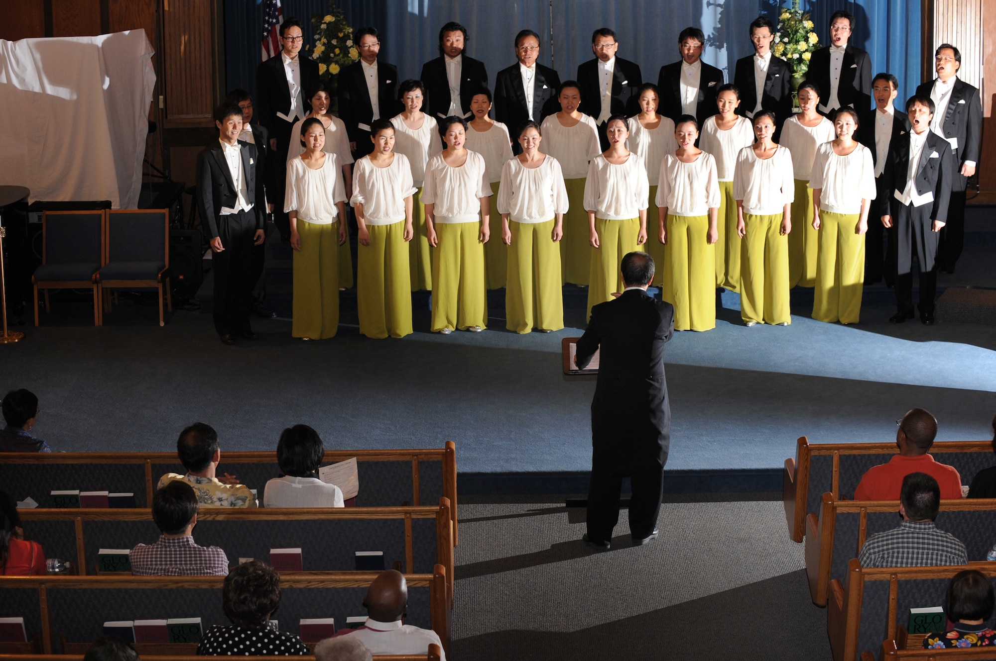 NELLIS AIR FORCE BASE, Nev. - Nellis Airmen, family and friends enjoyed an unforgettable performance by the Chai Hoon-Cha Choir, an internationally recognized choir from Seoul, South Korea, at the base chapel here, Aug. 10. The performance included seven songs, some were sang in English and others were sang in Korean. Founded in 2001, the group performed in the United States and Canada from Aug. 6 to 14.  This visit to Nellis marks a first for the Chai Hoon Cha Choir. (U.S. Air Force photo by Tech. Sgt. Michael R. Holzworth)