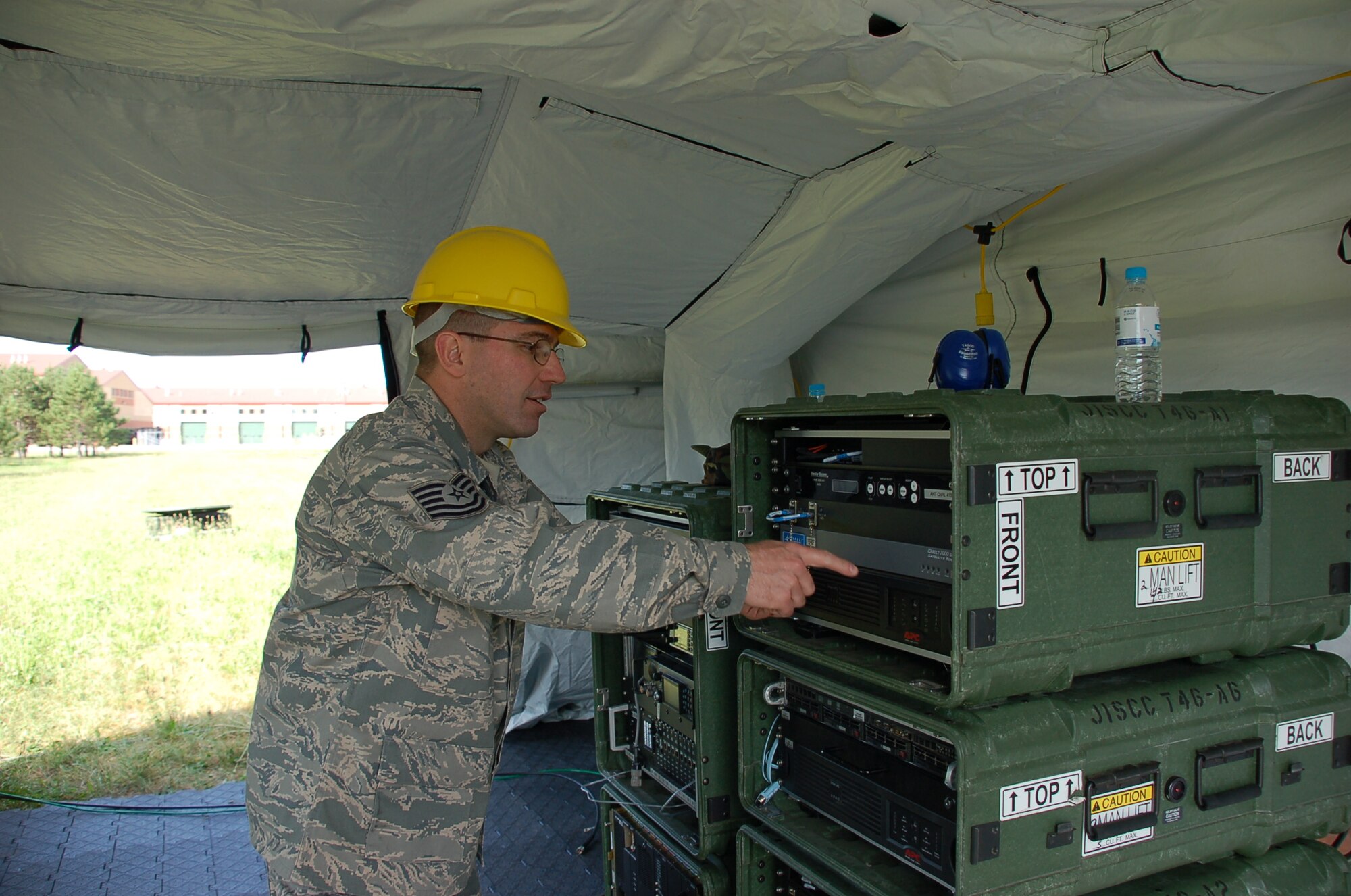 TSgt John Elliot of the 221st Combat Communications Squadron prepares the 
Joint Incident Site Communications Capability for Start up at Volk Field in July
during Patriot 09.