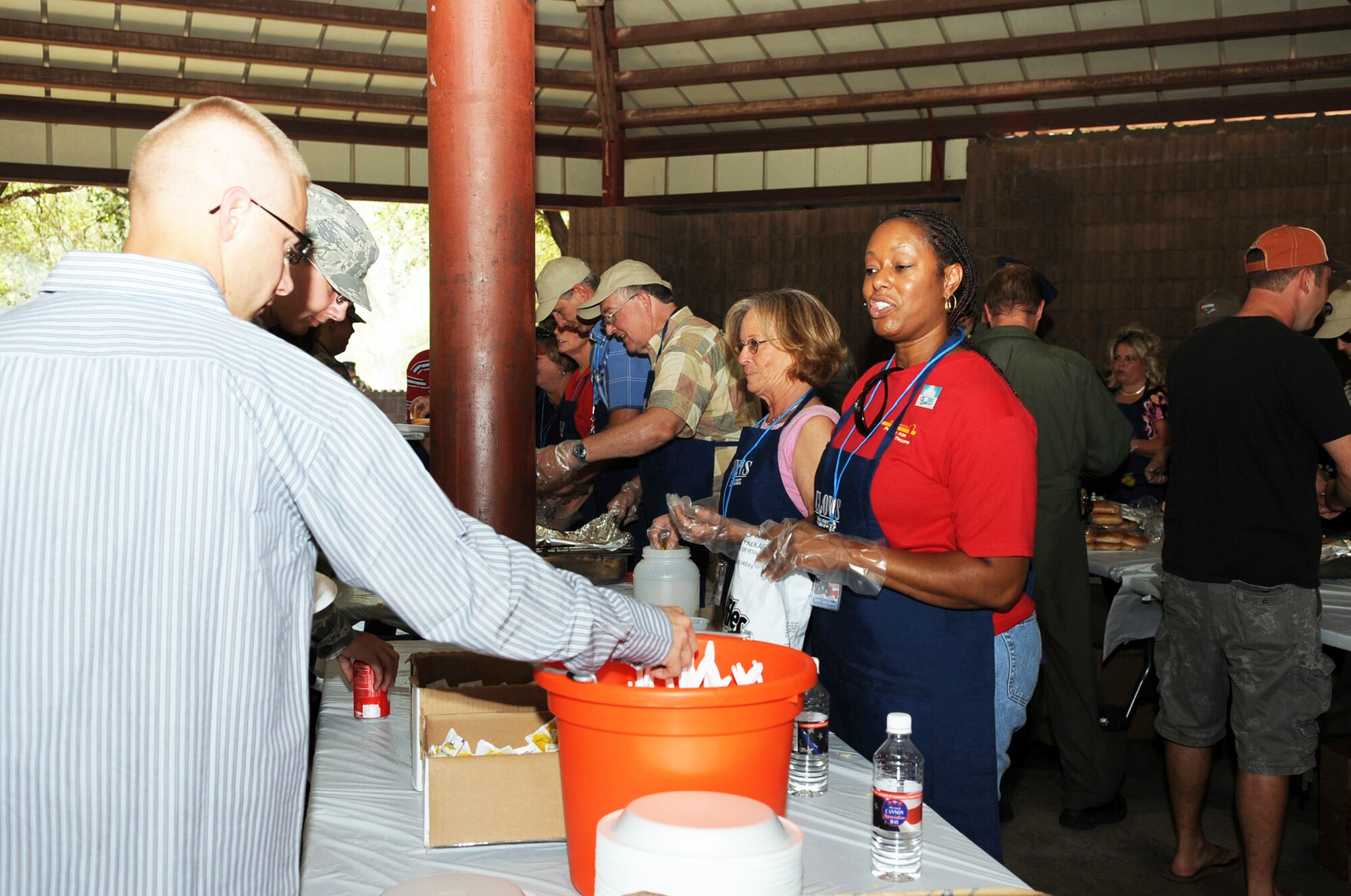 CANNON AIR FORCE BASE, N.M. -- Volunteers from the City of Clovis Chamber of Commerce and the Committee of 50 serve Airman and families of the 27th Special Operations Wing during Cannon Appreciation Day here Aug. 7. The 20th annual event included free food, drinks and a flatbed truck of prizes donated by the community for Airmen, family members and base civilian workers.  (U.S. Air Force photo by Staff Sgt. Heather R. Redman) 