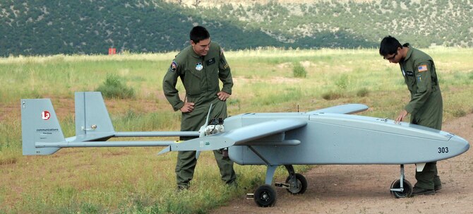 U.S. Air Force Academy Cadets 2nd Class Jeffrey Nakayama and Rupert Domingo inspect a Viking 300 unmanned aircraft vehicle before launch from Camp Red Devil July 20 at Fort Carson, Colo. The Academy's new UAS training is designed to encourage cadets to serve as UAS leaders after graduation. The Viking 300 weighs between 200 and 300 pounds and has a top speed of 100 knots, with a cruising speed of 55 knots. (U.S. Air Force photo/Ann Patton)