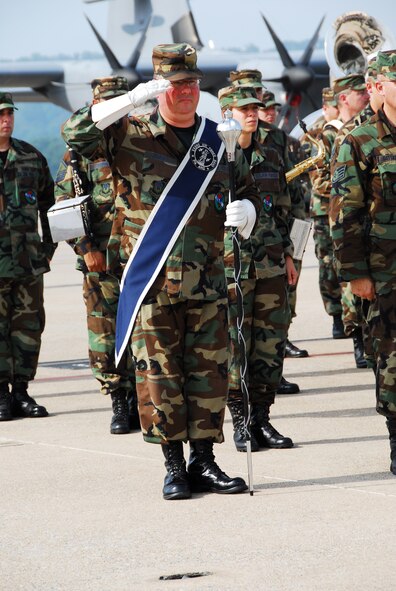 Master Sgt. John Christ of the 553rd Band of the Mid-Atlantic salutes during the Flight of Freedom ceremony at the 193rd Special Operations Wing, Middletown, Pa., on Sept. 9, 2008. Air Force photo by Staff Sgt. Mariko Rauch (released).