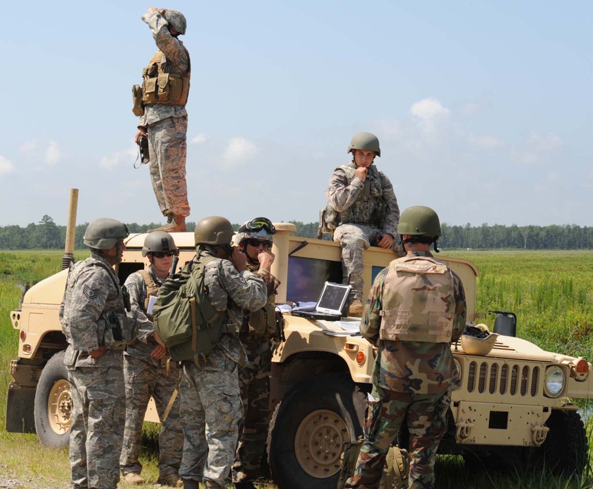A group of joint tactical air control party specialists, 14th Air Support Operations Squadron, Pope Air Force Base, perform individual evaluations at the Dare County Bomb Range, N.C., August 4, 2009. The evaluations consist of calling in air strikes during various scenarios they may encounter while in a deployed environment. (U.S. Air Force photo by Airman 1st Class Gino Reyes)