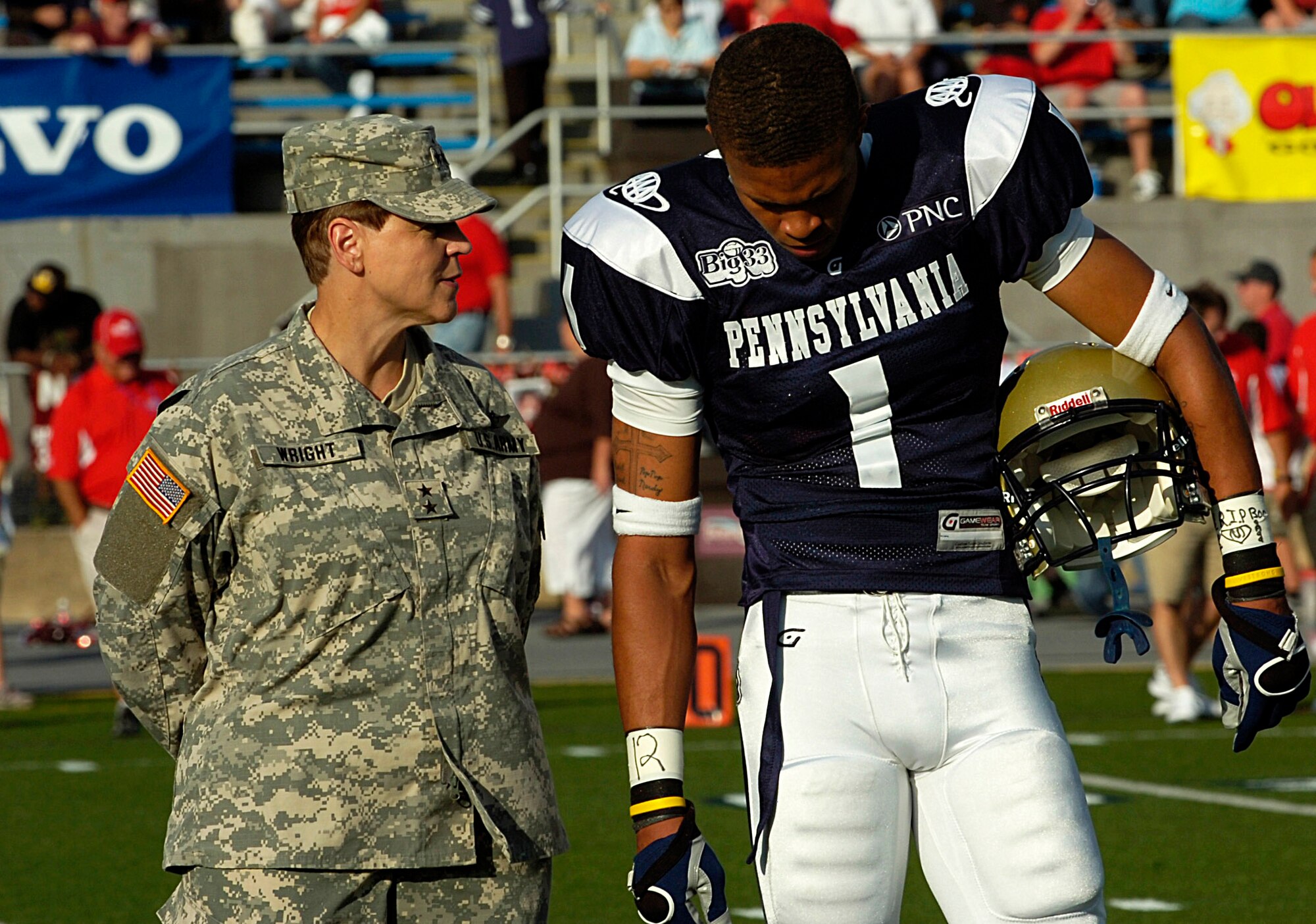 Maj. Gen. Jessica L. Wright, commander of the Pennsylvania National Guard, talked with starting wide receiver Malik Generett about the significance of the helmet sticker he will wear during the Big 33 Classic at Hersheypark Stadium, Hershey, Pa.