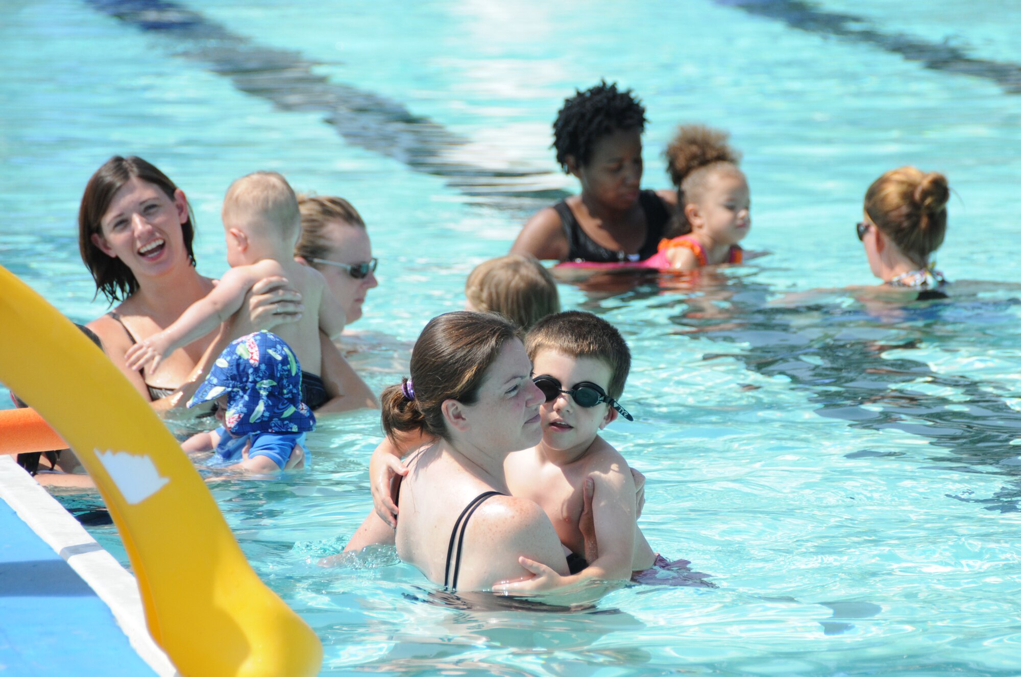 Keesler moms and their little ones enjoy the main base pool during swimming lessons earlier this summer.  Starting Monday, hours change for both base pools.  The main base pool is open noon to 5:30 p.m. Saturdays and Sundays.  As of Monday, the Triangle Pool is  open Mondays, Tuesdays, Thursdays and Fridays, 11 a.m. to 1 p.m. for lap swimming only and 4-7 p.m. for recreational swimming.  The Triangle Pool is open noon to 7 p.m. Saturdays and Sundays and is closed on Wednesdays.  Both pools close for the season Sept. 30.  (U.S. Air Force photo by Kemberly Groue)