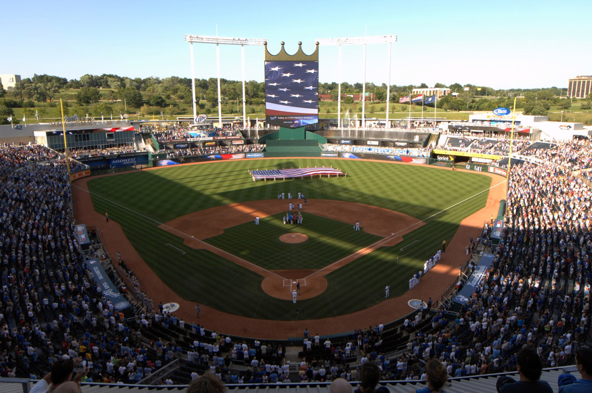 WHITEMAN AIR FORCE BASE, Mo. - Airman from Whiteman AFB stretch out a large American Flag Aug. 8 in center field during the National Anthem at Kauffman Stadium, as part of the Kansas City Royals Salute to Uniformed Heroes.  The Royals defeated the Oakland A’s 12-6. (U.S. Air Force photo/Senior Airman Jason Huddleston)