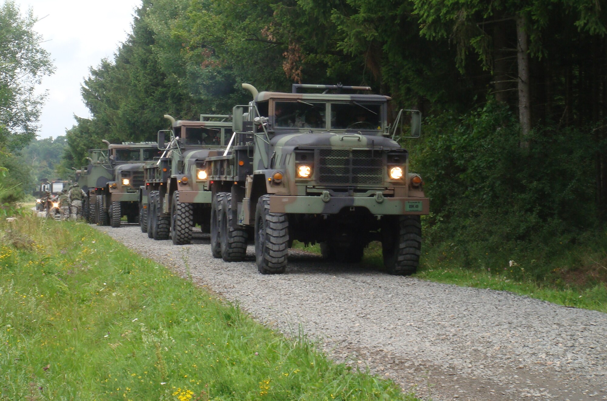 SPANGDAHLEM AIR BASE, Germany -- Members of the 606th Air Control Squadron stop their convoy and prepare to enter a ‘hostile’ territory near Gerolstein, Germany, Aug. 3 during a combat readiness training field exercise held Aug. 3-7. The purpose of the class is to show squadron members how to defend a deployed site without outside support, building on the 606th ACS mission to be self-sufficient. (U.S. Air Force photo/Staff Sgt. Daniel Heise)