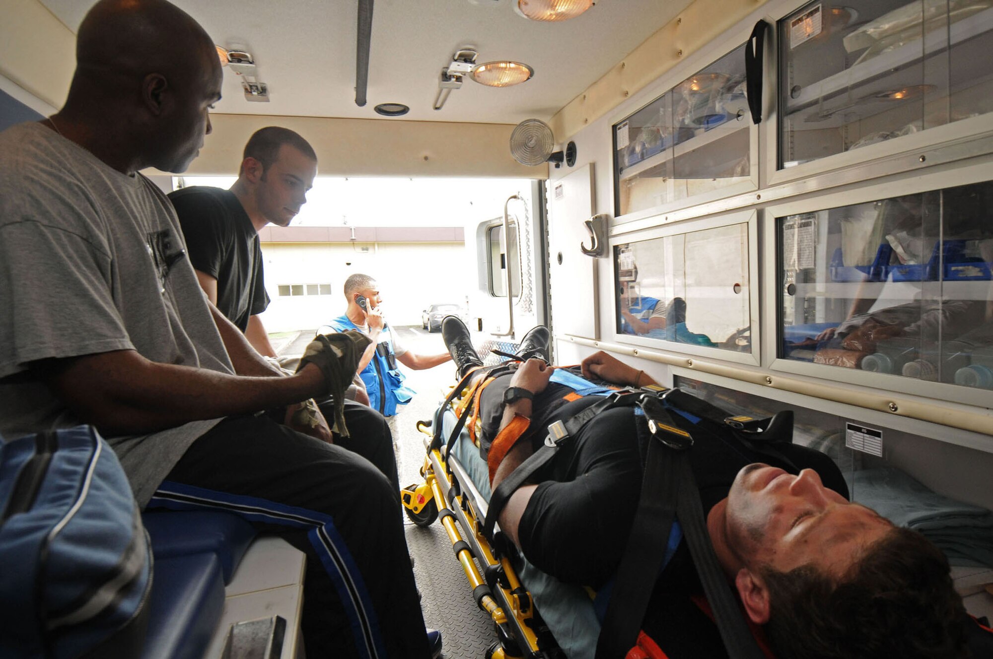 YOKOTA AIR BASE, Japan -- Airmen prepare for transportation to the 374th Medical Group to recive treatment for simulated wounds during exercise Beverly-Morning 09-06 Aug. 11. Yokota is conducting a phase I and II exercise Aug. 11-14 to prepare for an upcoming operational readiness inspection. (U.S. Air Force photo/Staff Sgt. Veronica Pierce) 
