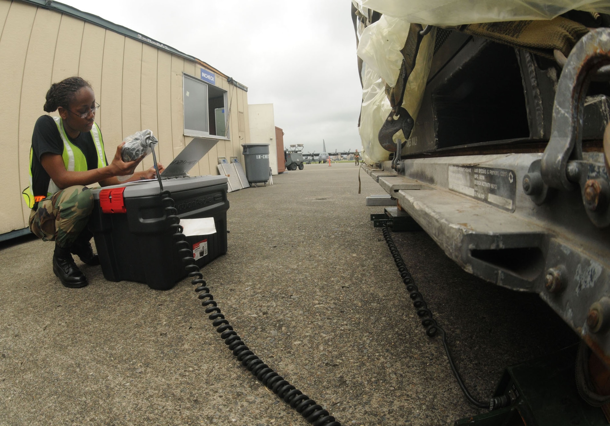 YOKOTA AIR BASE, Japan -- Airman 1st Class Semaj Everette, 374th Logistics Readiness Squadron equipment management element technician, weighs medical supply cargo, Aug. 11, during exercise Beverly-Morning 09-06. Yokota is conducting a phase I and II exercise Aug. 11-14 to prepare for an upcoming operational readiness inspection. (U.S. Air Force photo/Staff Sgt. Veronica Pierce)