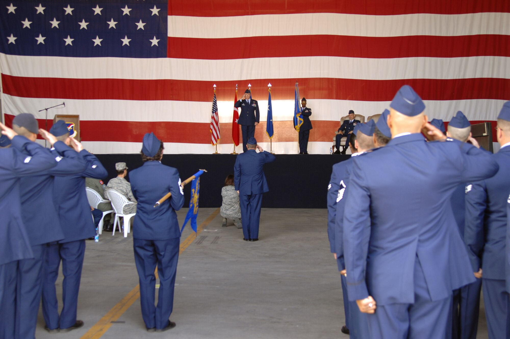 Col. Eric Beene, 39th Air Base Wing commander, renders his first salute to the troops during a ceremony Tuesday, Aug. 11, 2009 in Hangar 4, Incirlik Air Base, Turkey.  Colonel Beene is the former chief of strategy of the Directorate of Strategy, Policy and Assessments at Headquarters U.S. European Command, Patch Barracks, Germany.  Colonel Beene was commissioned in 1986 from the U.S. Air Force Academy, Colorado Springs, Colo. He is a senior navigator with 1,895 flying hours in the F-111A, FB-111A, F-111E and F-15E. He has commanded at the squadron and group levels. In addition to Headquarters U.S. European Command, his previous staff tours include Headquarters U.S. Air Force and Headquarters 8th Air Force.  (U.S. Air Force photo/Staff Sgt. Lauren Padden)
