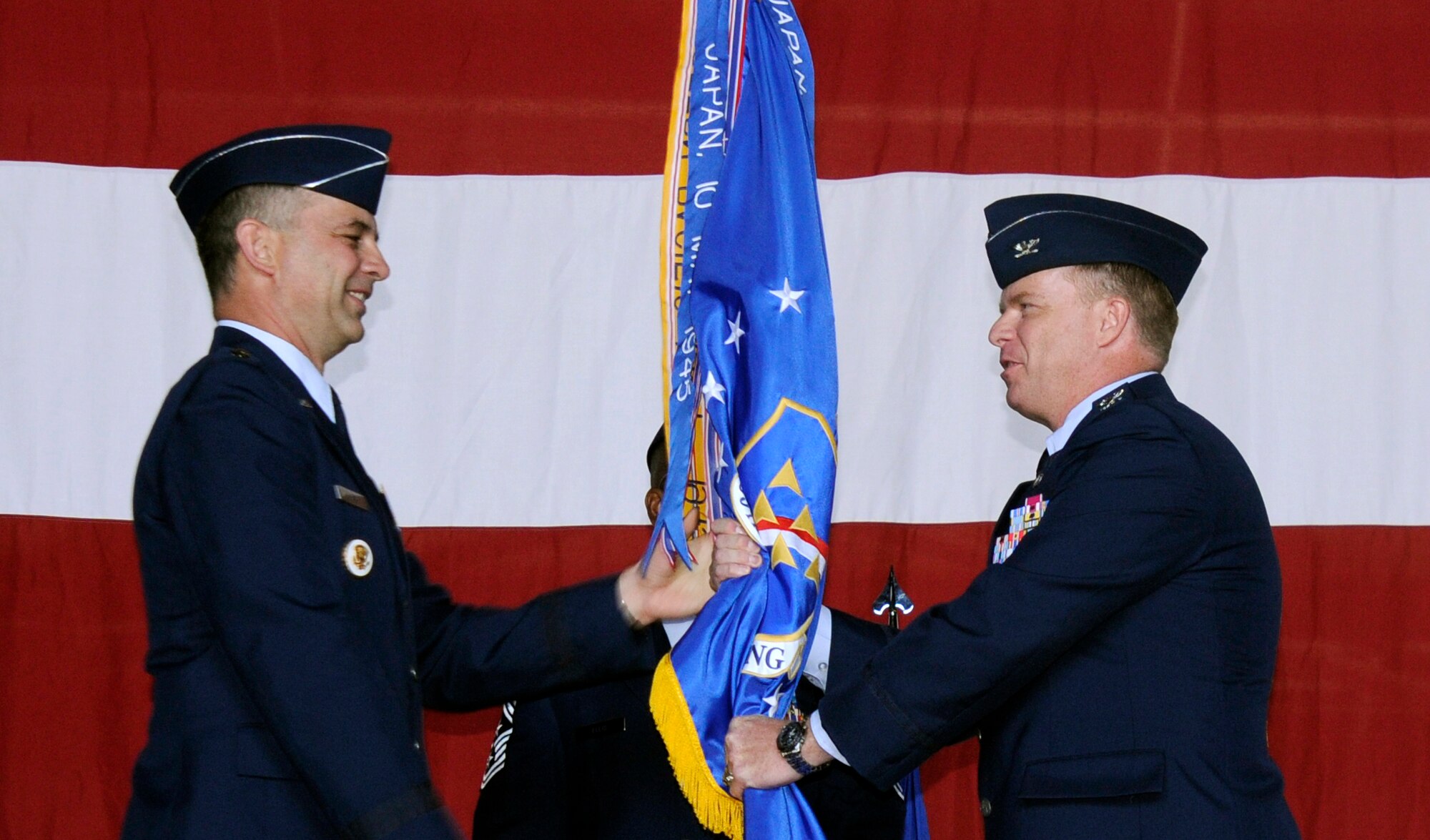 Maj. Gen. Mark Zamzow, 3rd Air Force Vice Commander, presents the flag to Col. Eric Beene during a change of command ceremony Tuesday, Aug. 11, 2009 in Hangar 4, Incirlik Air Base, Turkey.  Colonel Beene is the former chief of strategy of the Directorate of Strategy, Policy and Assessments at Headquarters U.S. European Command, Patch Barracks, Germany.  Colonel Beene was commissioned in 1986 from the U.S. Air Force Academy, Colorado Springs, Colo. He is a senior navigator with 1,895 flying hours in the F-111A, FB-111A, F-111E and F-15E. He has commanded at the squadron and group levels. In addition to Headquarters U.S. European Command, his previous staff tours include Headquarters U.S. Air Force and Headquarters 8th Air Force. (U.S. Air Force photo/Airman 1st Class Amber Ashcraft)