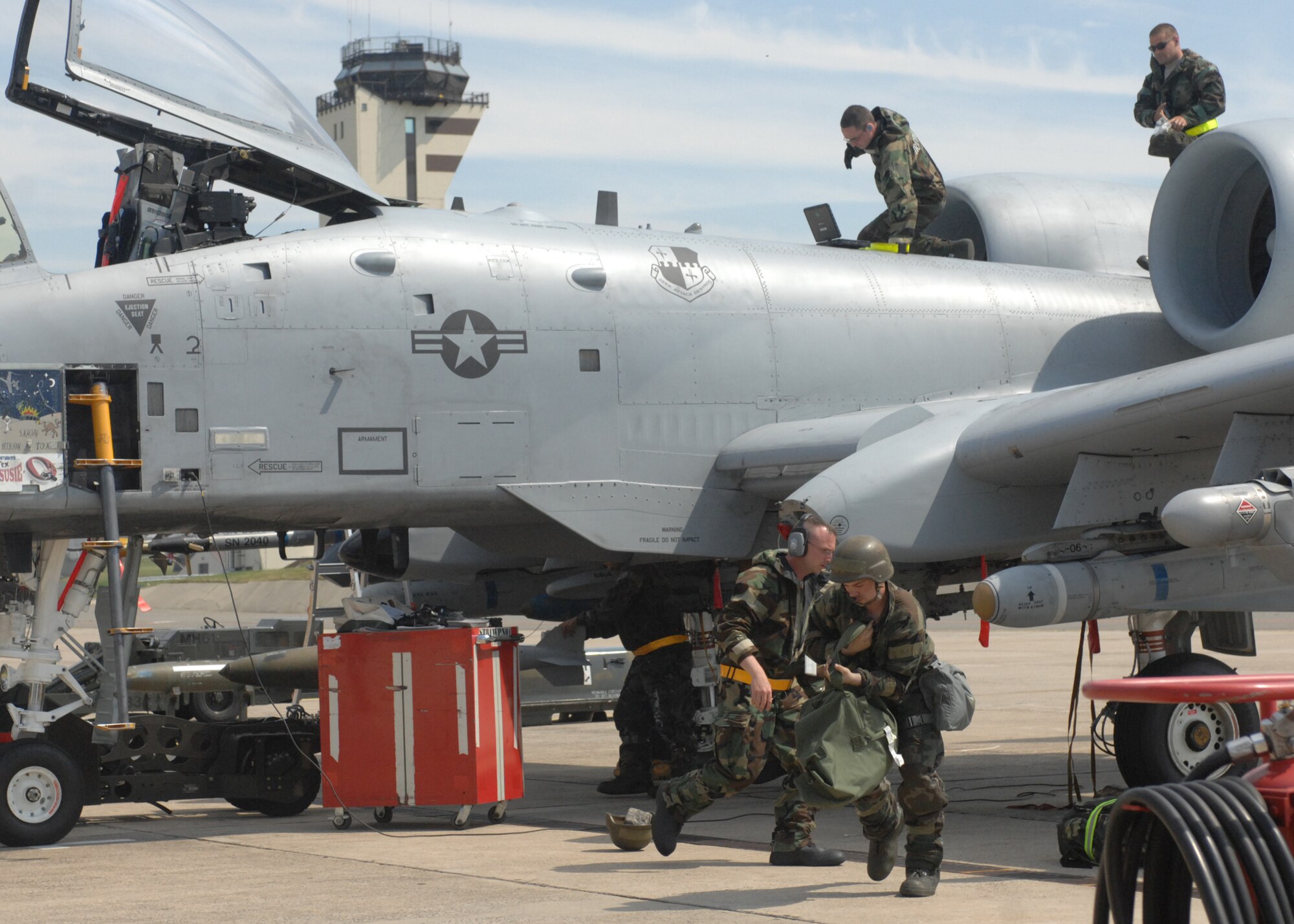 SPANGDAHLEM AIR BASE, Germany -- Members of the 52nd Aircraft Maintenance Squadron, 52nd Equipment Maintenance Squadron and 81st Fighter Squadron take shelter inside hangars 1 and 2 and Aug. 6 during the 52nd Fighter Wing’s Phase II exercise. During a simulated chemical attack Airmen sought shelter inside hangers 1 and 2. (U.S. Air Force photo/Senior Airman Jenifer H. Calhoun)