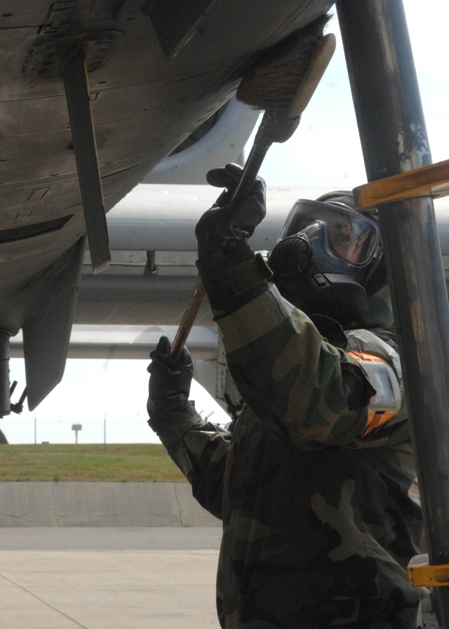 SPANGDAHLEM AIR BASE, Germany -- Senior Airman Bryan Craver, 52nd Aircraft Maintenance Squadron, decontaminates an A-10 Thunderbolt II outside hangars 1 and 2 Aug. 6 during the 52nd Fighter Wing’s Phase II exercise. Airmen were required to decontaminate the jet while in mission oriented protective posture 4 while being evaluated during an inject by the exercise evaluation team in preparation for the upcoming NATO Tactical Evaluation in June 2010. (U.S. Air Force photo/Senior Airman Jenifer H. Calhoun)