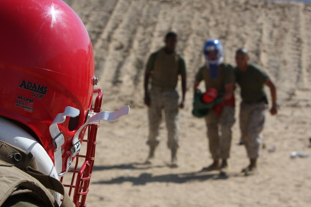 Lance Cpl. Justin Brock, a student in the 3rd Combat Engineer Battalion’s Marine Corps Martial Arts Program gray belt course, stares down his opponent during a pugil sticks match here Aug. 12. Brock, a Loveland, Ohio, native, said this was the first time since boot camp that he has had the chance to participate in pugil sticks.::r::::n::