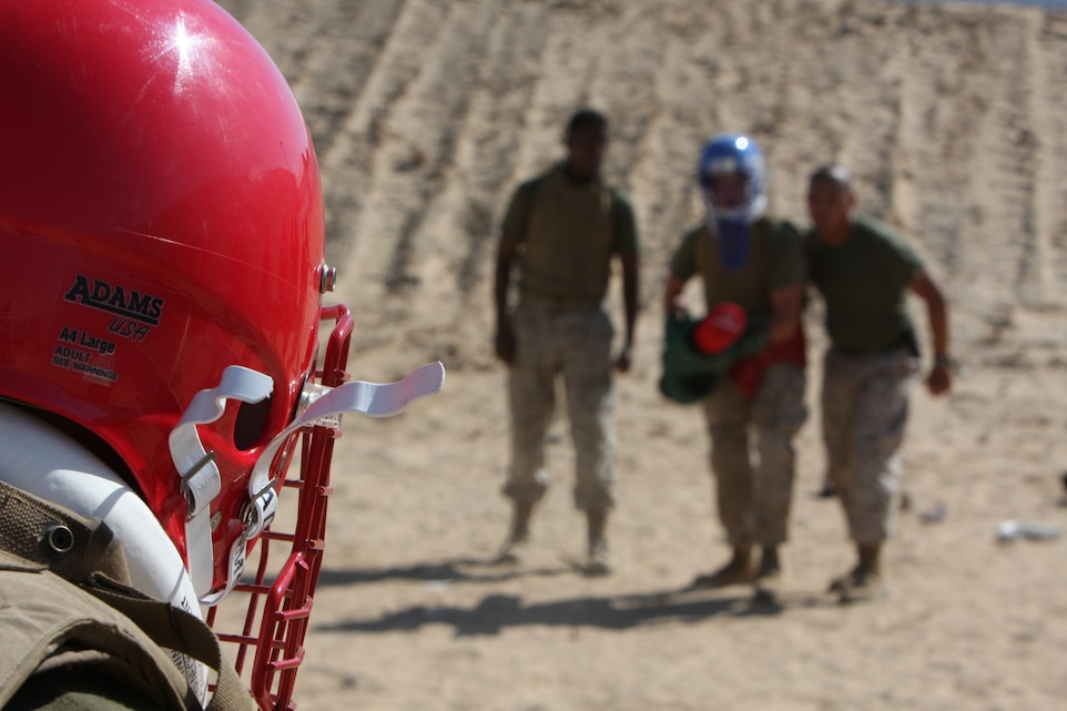 Lance Cpl. Justin Brock, a student in the 3rd Combat Engineer Battalion’s Marine Corps Martial Arts Program gray belt course, stares down his opponent during a pugil sticks match here Aug. 12. Brock, a Loveland, Ohio, native, said this was the first time since boot camp that he has had the chance to participate in pugil sticks.::r::::n::