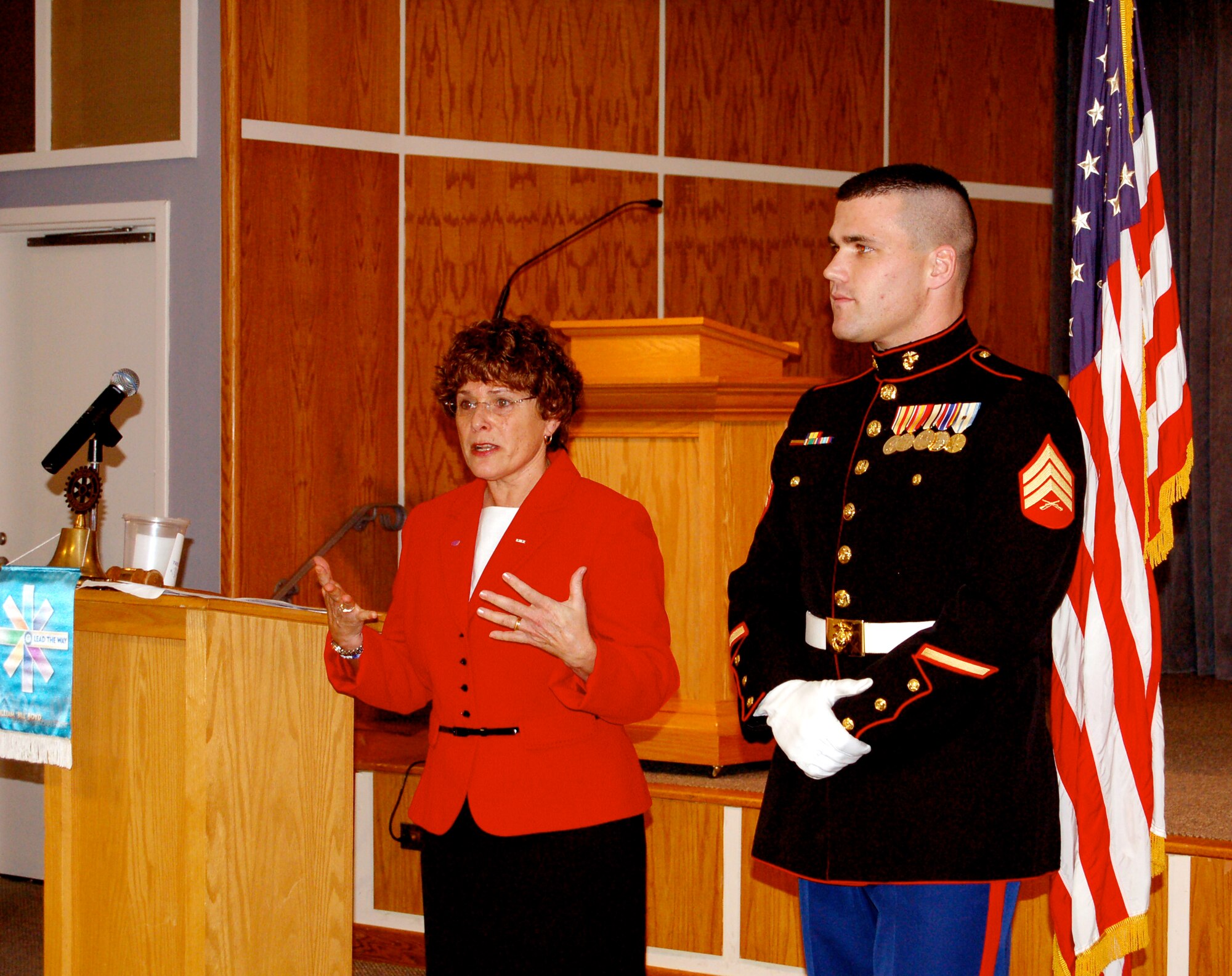 U.S. Marine Staff Sgt. Crowley is awarded a Quilt of Valor from Catherine Roberts, the founder of the Quilts of Valor Foundation, at the Nanticoke Rotary Club in Seaford, Del., Nov. 29, 2006. (Photo courtesy of Catherine C. Roberts, Quilts of Valor Foundation)