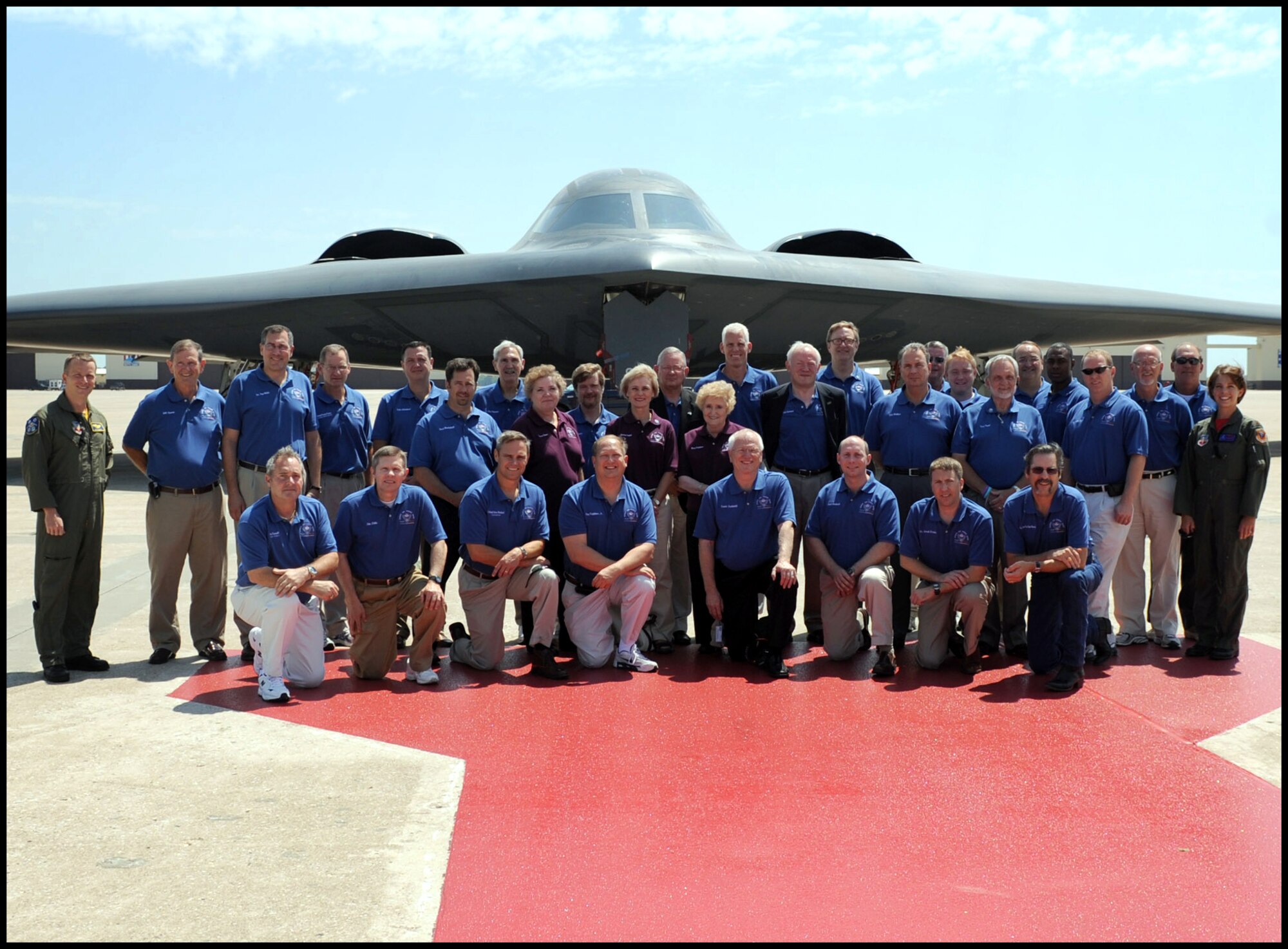 Members of the July 23 and 24 Vance AFB Community Relations tour pose in front of the B-2 Spirit, a multi-role bomber, assigned to the 509th Bomb Wing at Whiteman AFB, Mo. At far left and far right are Majs. Rob and Beth Makros, B-2 pilots who were previously assigned at Vance. The tour group members included civic, business and educational leaders from throughout northern Oklahoma. (Courtesy photo)