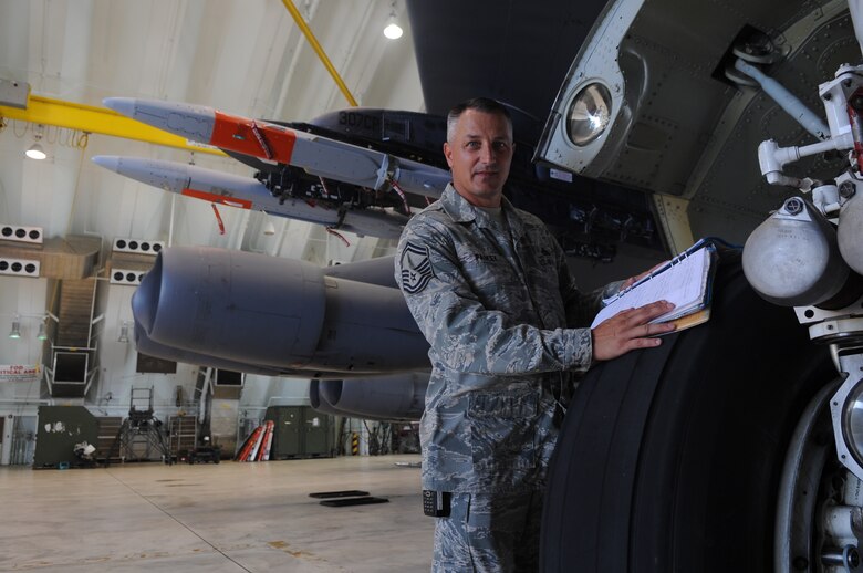 Senior Master Sgt. Carl Paskey stands next to a B-52 Stratofortress at Andersen Air Force Base, Guam, Aug. 11, where he is deployed as the 96th Expeditionary Aircraft Maintenance Unit lead production superintendent. The Orwell, Ohio, native has been to Guam 31 times over 11 years.  He is currently deployed to Andersen supporting U.S. Pacific Command’s Continuous Bomber Presence mission in the Asia-Pacific region. (U.S. Air Force photo/ Senior Airman Christopher Bush)