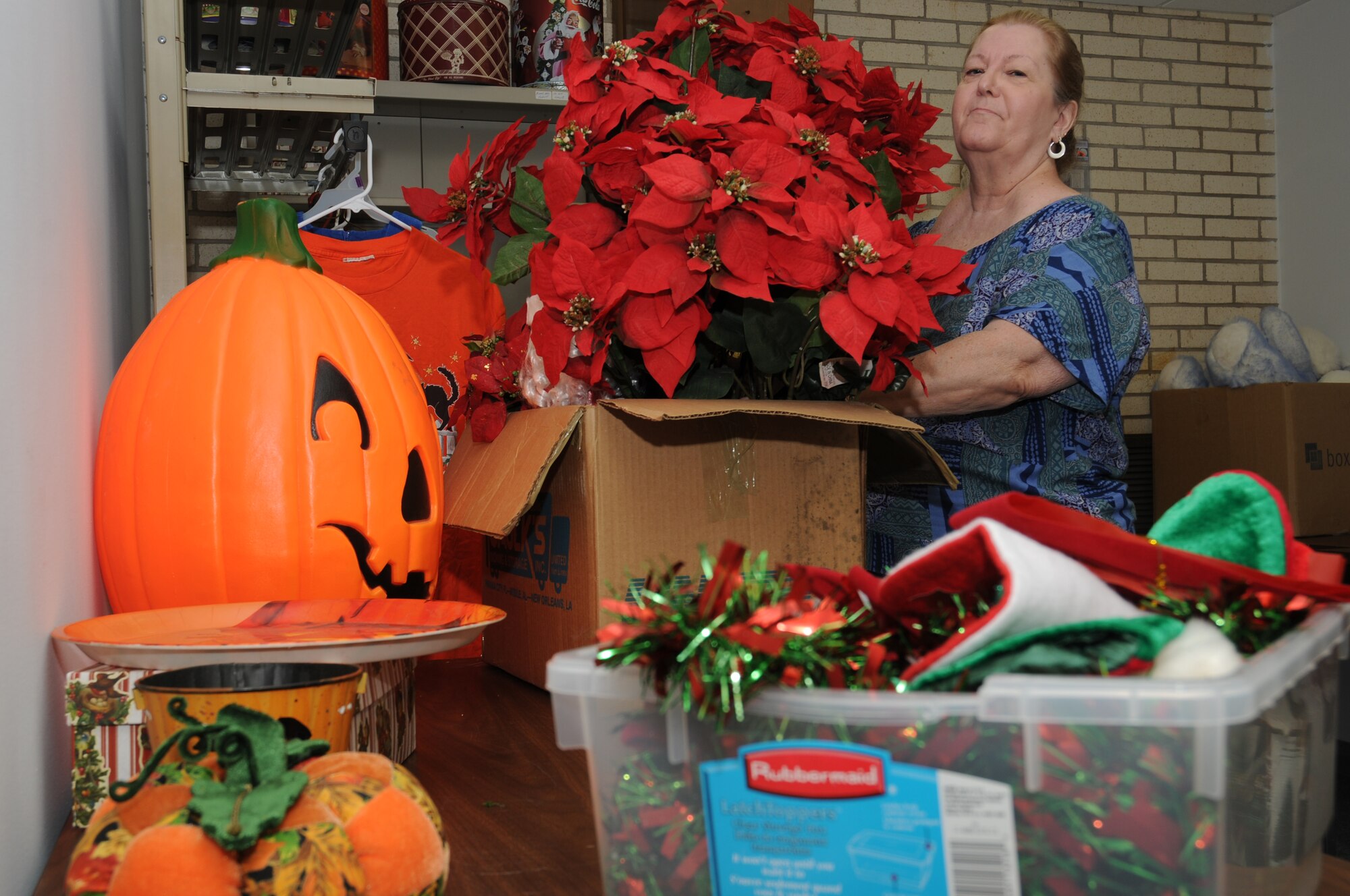 Volunteer Marilyn Reed organizes the “seasonal room.”  Her daughter is Master Sgt. Elisabeth Reed, 81st DS first sergeant.  (U.S. Air Force photo by Kemberly Groue)