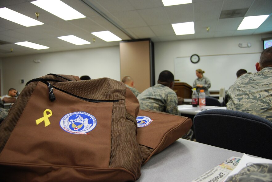 The 433rd Airlift Wing Yellow Ribbon Reintegration Program provided brown shoulder bags embroidered with a yellow ribbon, to service members during a recent Yellow Ribbon pre-deployment seminar. The seminar was held Aug. 2, 2009 at the 26th Aerial Port Squadron headquarters building in San Antonio, Texas.  
The Yellow Ribbon Reintegration Program is designed to help service members and families prepare for challenges during a deployment cycle. 
Representatives from more than a dozen organizations such as the Red Cross, the 433rd Airlift Wing legal office and the Employment Support for Guard and Reserve (ESGR) participated in the event. The representatives presented information on deployment-related matters such as physical separation from loved ones, care or guardianship of dependants, family and individual counseling, employment rights and legal matters such as wills and powers of attorney documents. Seminar attendees used the bags to collect goodies and informational materials such as business cards, pamphlets and flyers. (U.S. Air Force photo/Senior Airman Luis Loza Gutierrez)
For more information about the Yellow Ribbon Reintegration Program use the following link: http://www.af.mil/news/story.asp?id=123123264 