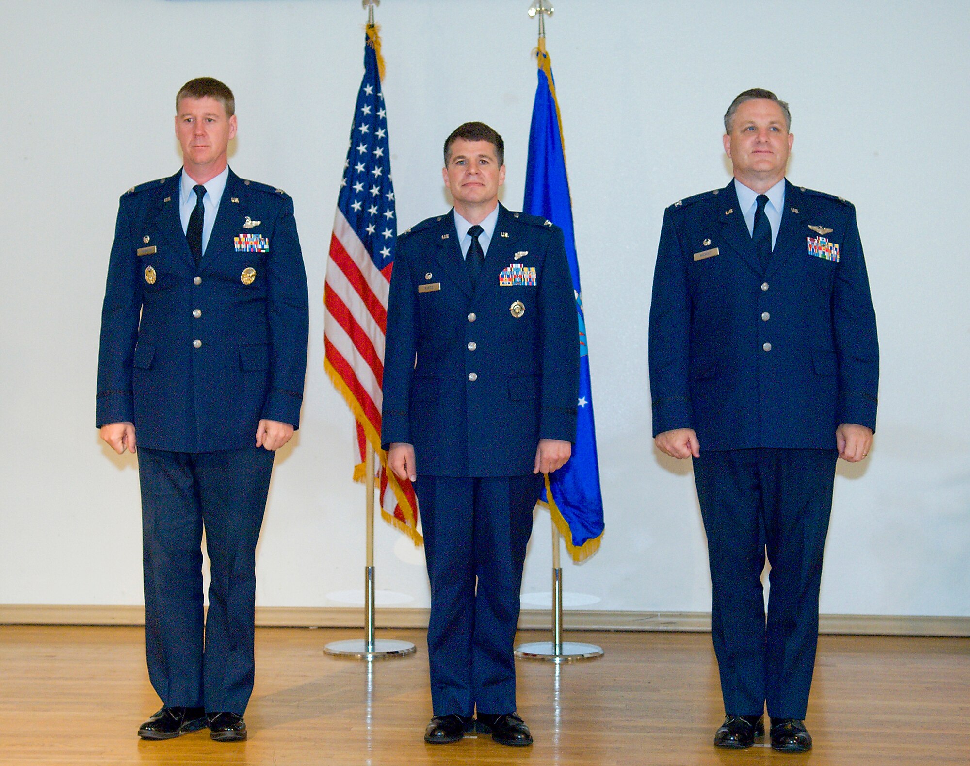 Col. William Thornton (left) presided over a change of command ceremony in which Col. Russell Kurtz (center) succeeded Col. Joseph Nichols (right) as the 412th Electronic Warfare Group commander Aug. 6. Colonel Nichols retires in August 2009. (Air Force photo/Mike Cassidy) 