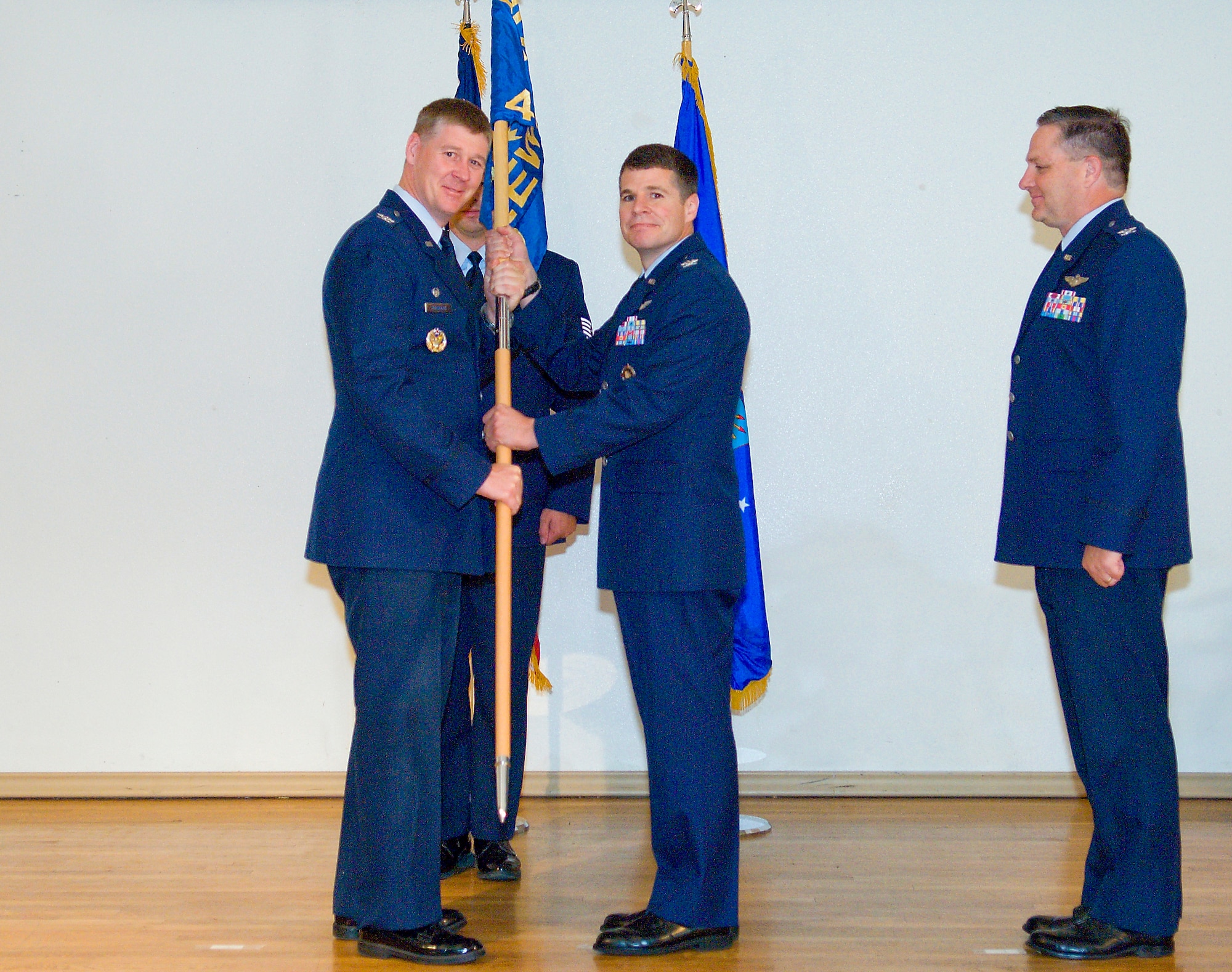 Col. William Thornton (left) presided over a change of command ceremony in which Col. Russell Kurtz (center) succeeded Col. Joseph Nichols (right) as the 412th Electronic Warfare Group commander Aug. 6. Colonel Nichols retires in August 2009.  (Air Force photo/Mike Cassidy) 