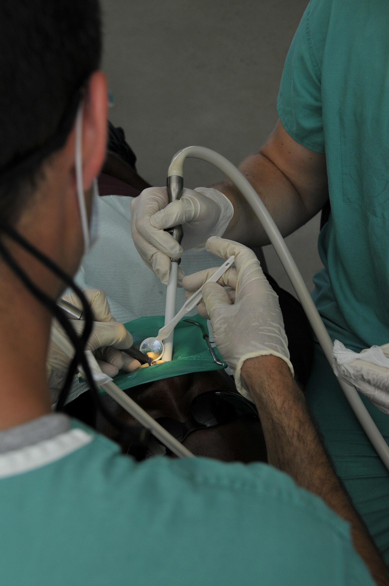 Airmen from the 375th Dental Squadron, Scott AFB, Illinois, hardens provide dental services during New Horizons Guyana, at the Diamond School Aug 10, 2009, in Diamond, Guyana. New Horizons Guyana 2009 is a U.S. Southern Command-sponsored humanitarian event that will benefit thousands of Guyanese citizens in Georgetown and outlying areas.(U.S. Air Force photo by Airman 1st Class Perry Aston) (Released)